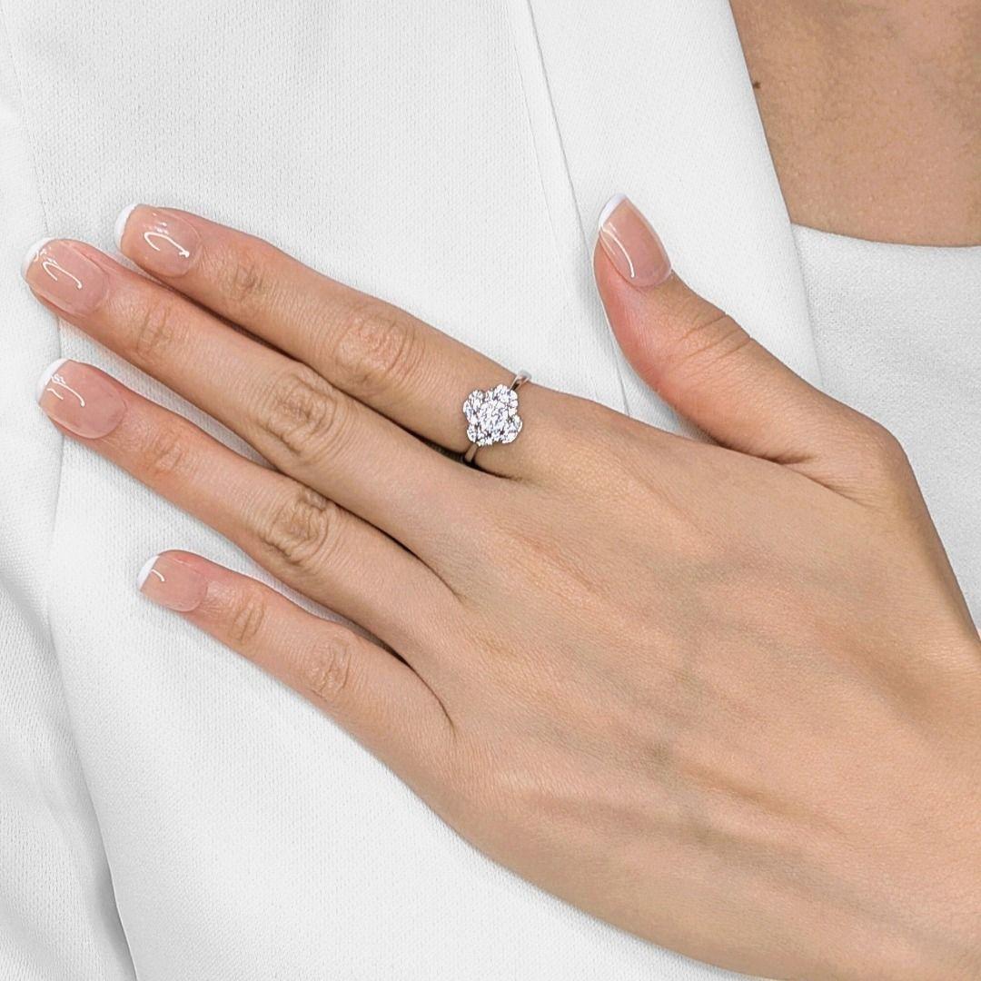 Embrace luck and luxury with this sparkling, unworn cluster ring, ingeniously designed in a charming four-leaf clover motif and crafted in radiant 18K white gold. Thirty-four dazzling natural round brilliant diamonds, totaling a brilliant 0.28ct,
