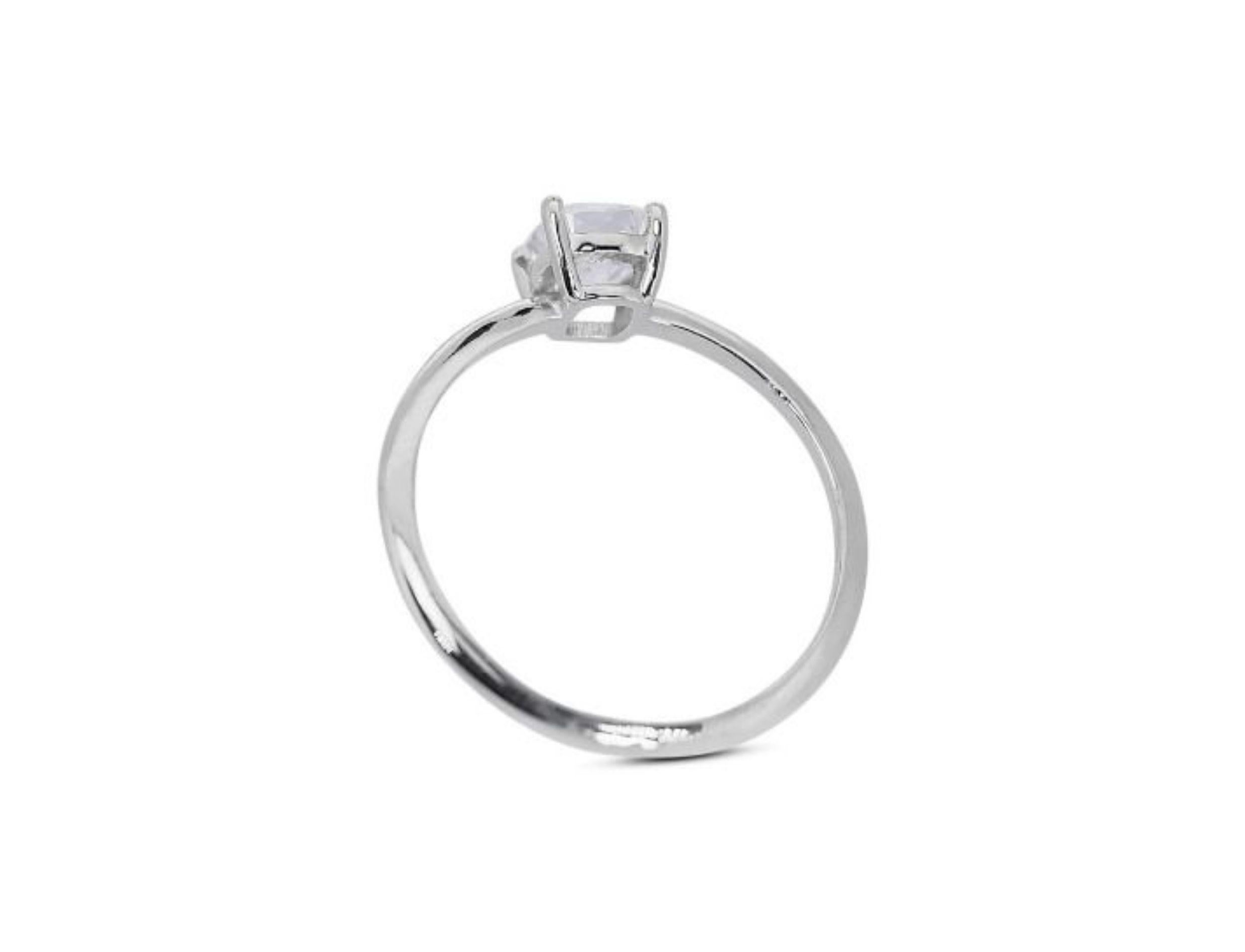 This stunning ring features a dazzling 0.7 carat E color, VS1 clarity cushion modified brilliant diamond. The diamond is set in 18K white gold with a high quality polish. The ring comes with a GIA certificate and a nice jewelry box.

The cushion
