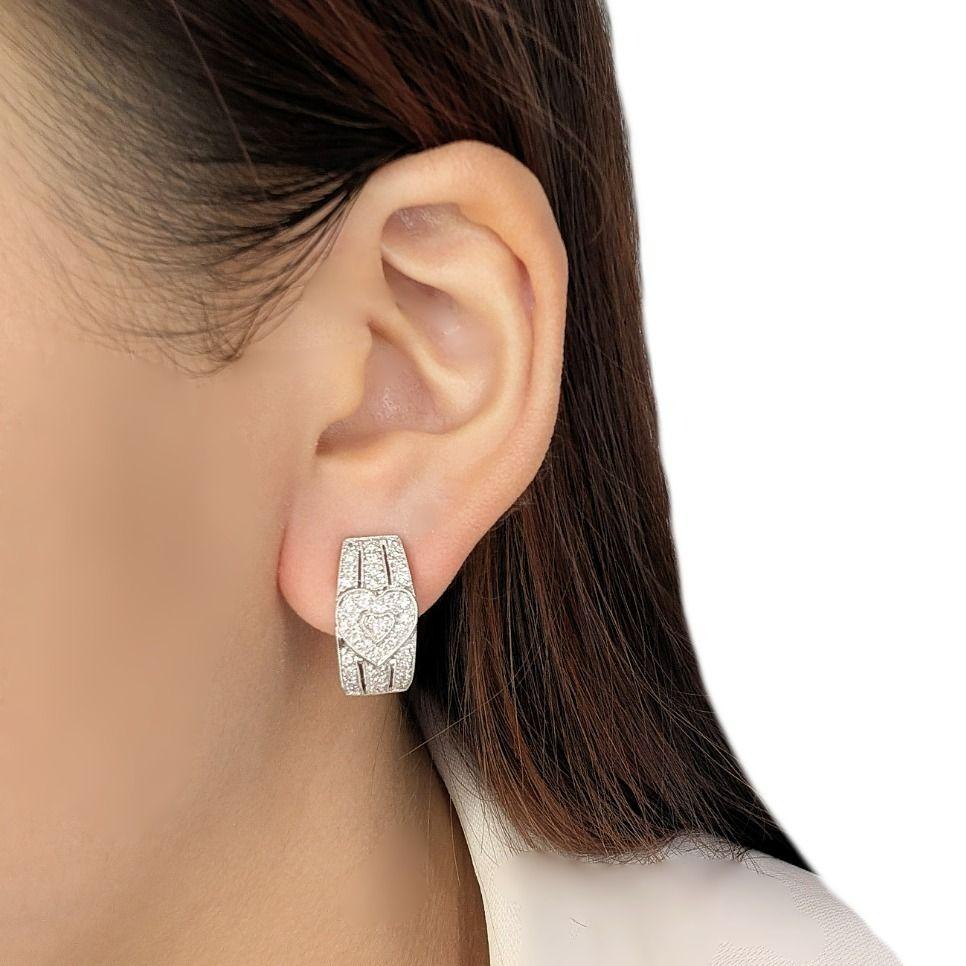 A cascade of brilliance, a symphony of sparkling diamonds framing your face with secure elegance. These new 18K white gold latch back earrings are adorned with 72 round brilliant diamonds, totaling 0.72ct, their G-H color and VS clarity radiating a