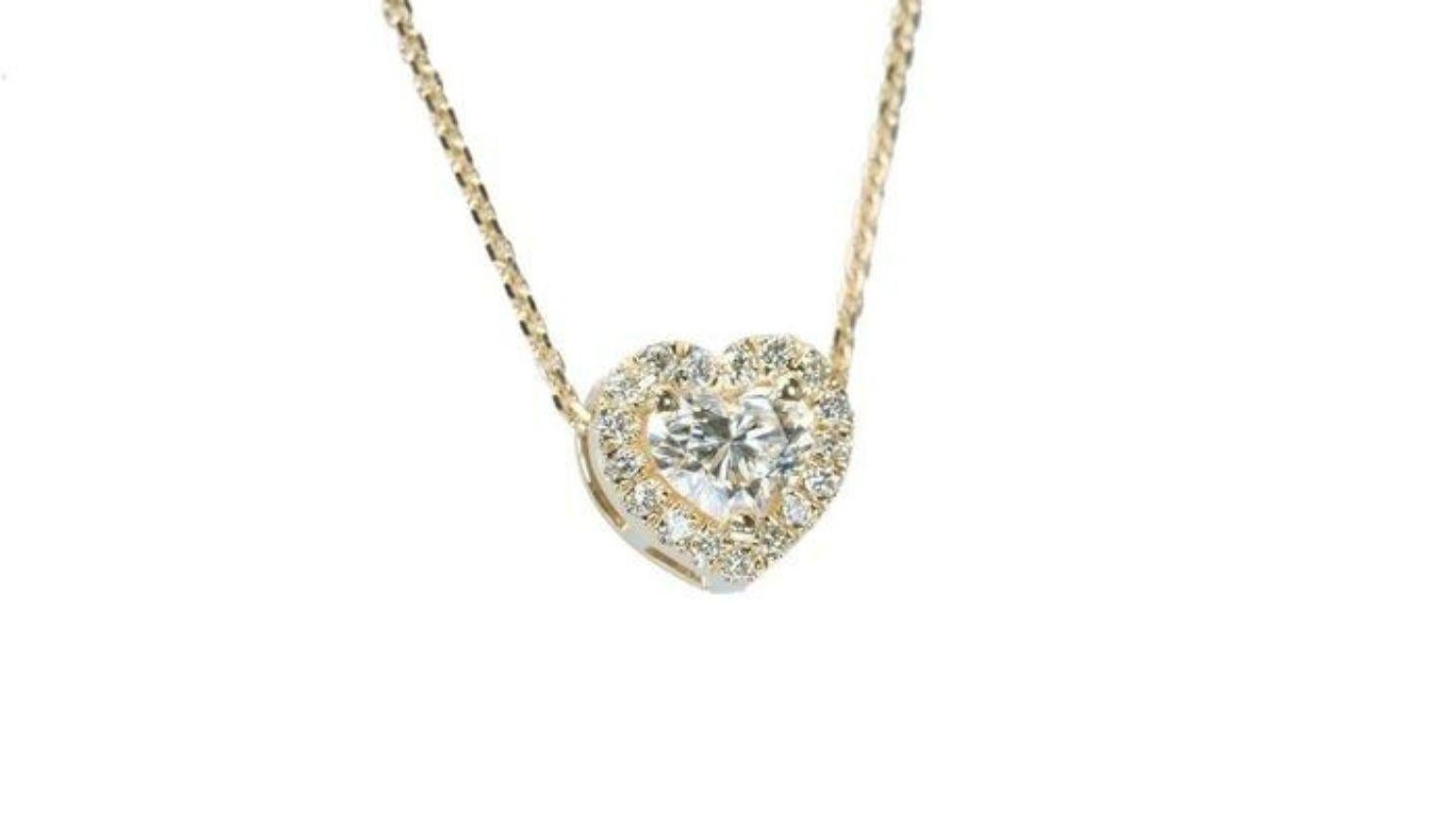 This exquisite necklace is a love letter to brilliance, featuring a mesmerizing 0.74 carat heart brilliant diamond that radiates pure enchantment. Its captivating cut catches every ray of light, transforming into a breathtaking kaleidoscope of
