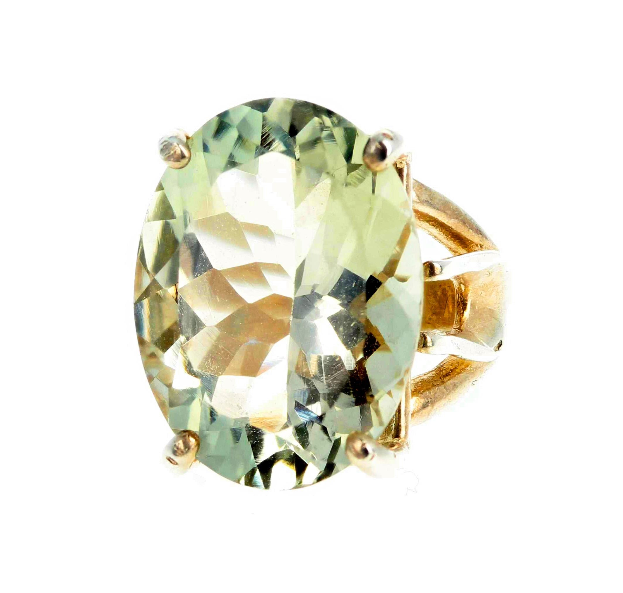 Glittering sparkling glowing huge 12 carat Green Amethyst (18.8 mm x 14.2 mm set in a sterling silver ring size 5 sizable.  There are no eye visible inclusions in this gorgeous green Amethyst.  Spectacular optical effect  exhibits green and silver