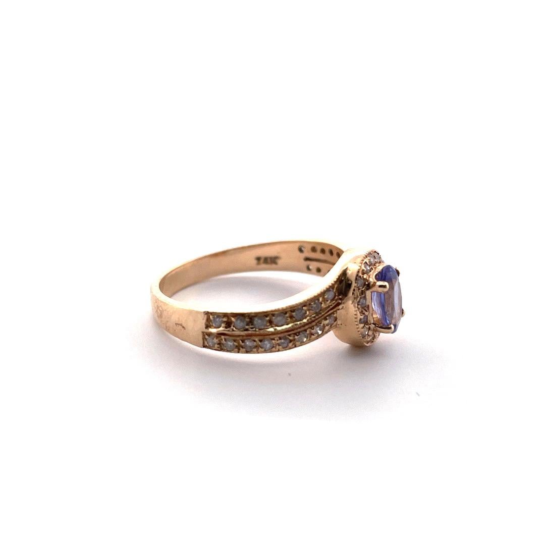 Sparkling 14K Yellow Gold Tanzanite and Diamond Ring

Crafted from luxurious 14K gold (engraving 14k), this ring is both sophisticated and unique. The centerpiece of the ring is a gorgeous Tanzanite gemstone, weighing 0.4tcw. The stone's deep