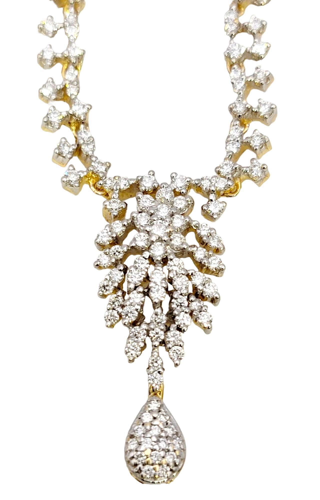 You will absolutely adore this distinctive diamond drop necklace.  Warm yellow gold is paired with sparkling white diamonds in a chic 'Y' design, making this glittering beauty one of your new favorite pieces. 

This lovely necklace features a
