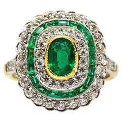 Sparkling 18 Karat Gold and Platinum Diamonds and Emeralds Ring