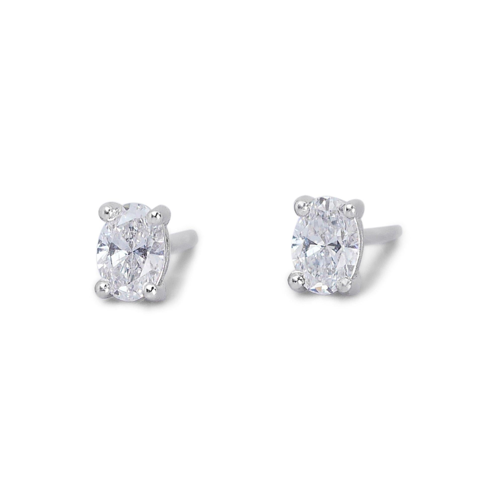 Sparkling 1.82ct Diamond Stud Earrings in 18k White Gold - GIA Certified 

Elevate your style with these exquisite diamond stud earrings crafted in 18k white gold. Each earring features a stunning oval diamond, with a combined total weight of