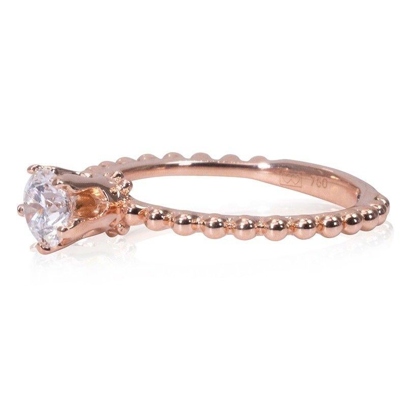 A stunning solitaire ring with a dazzling 0.40 carat round brilliant diamond in F VS2 with ideal cut as the ring. The jewelry is made of 18K rose gold with a high quality polish. The main stone is engraved with a laser inscription and has a GIA
