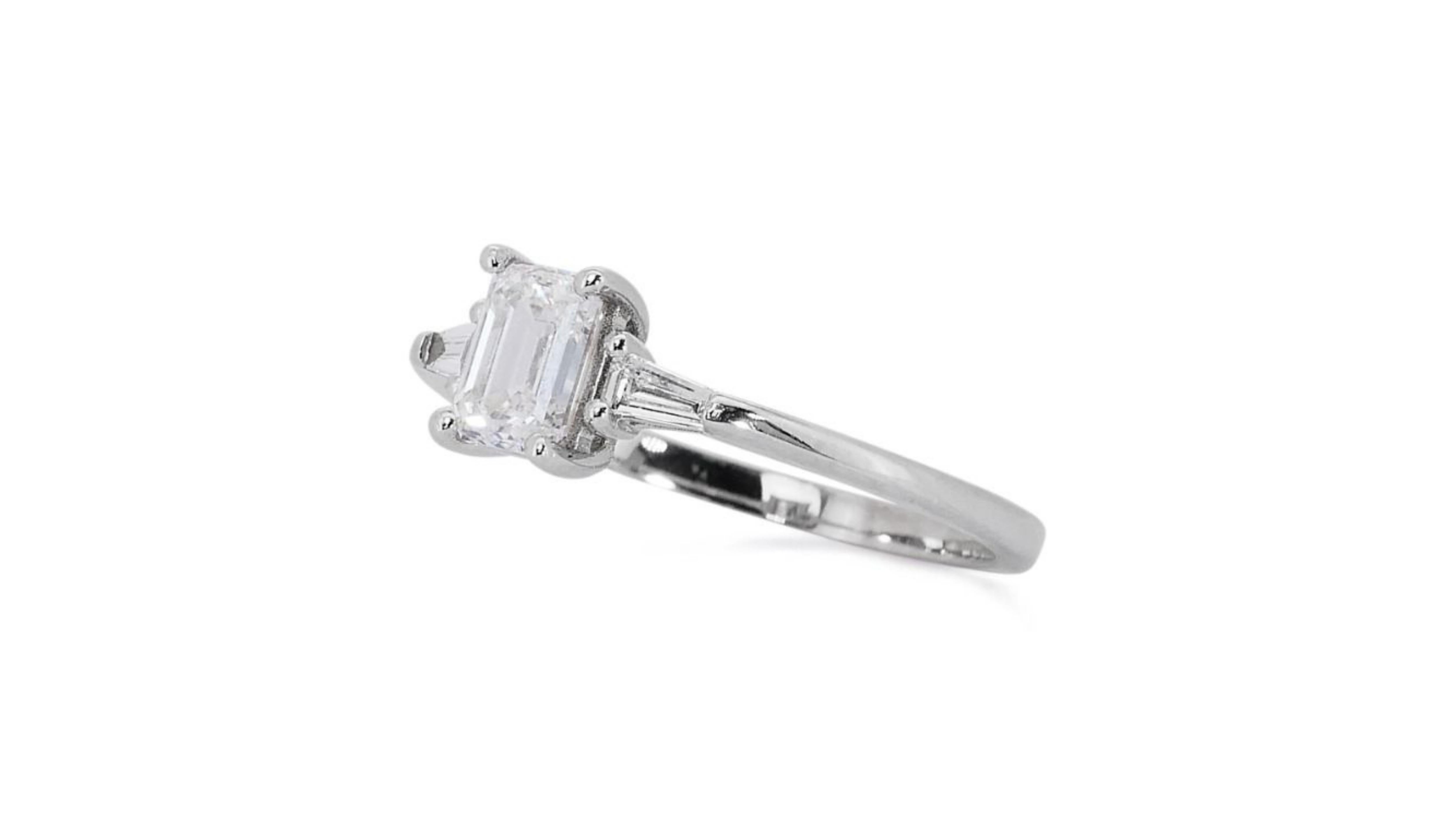 Sparkling 18k White Gold .71ct Emerald Cut Three Stone Diamond Ring For Sale 1