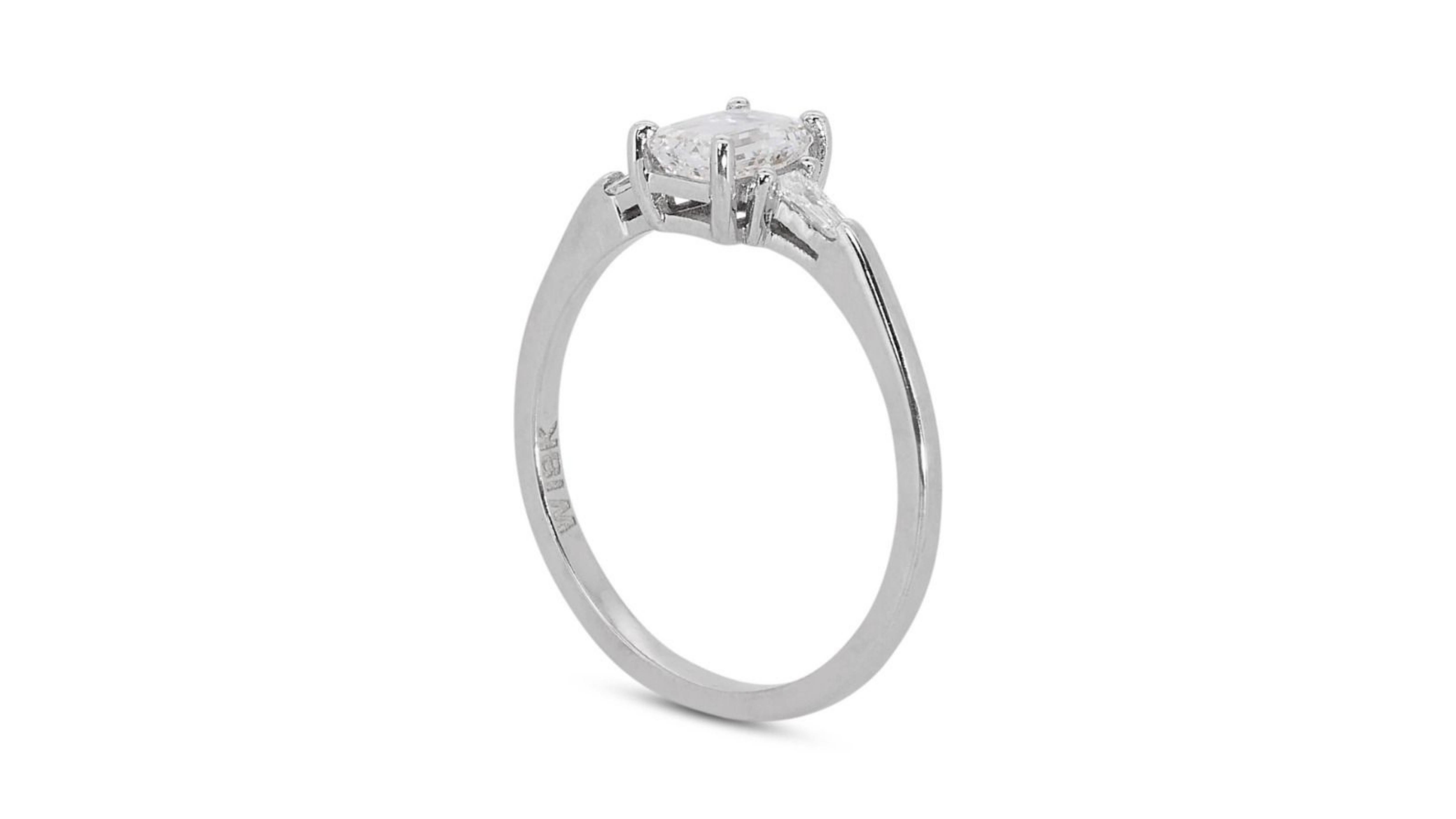 Sparkling 18k White Gold .71ct Emerald Cut Three Stone Diamond Ring For Sale 2