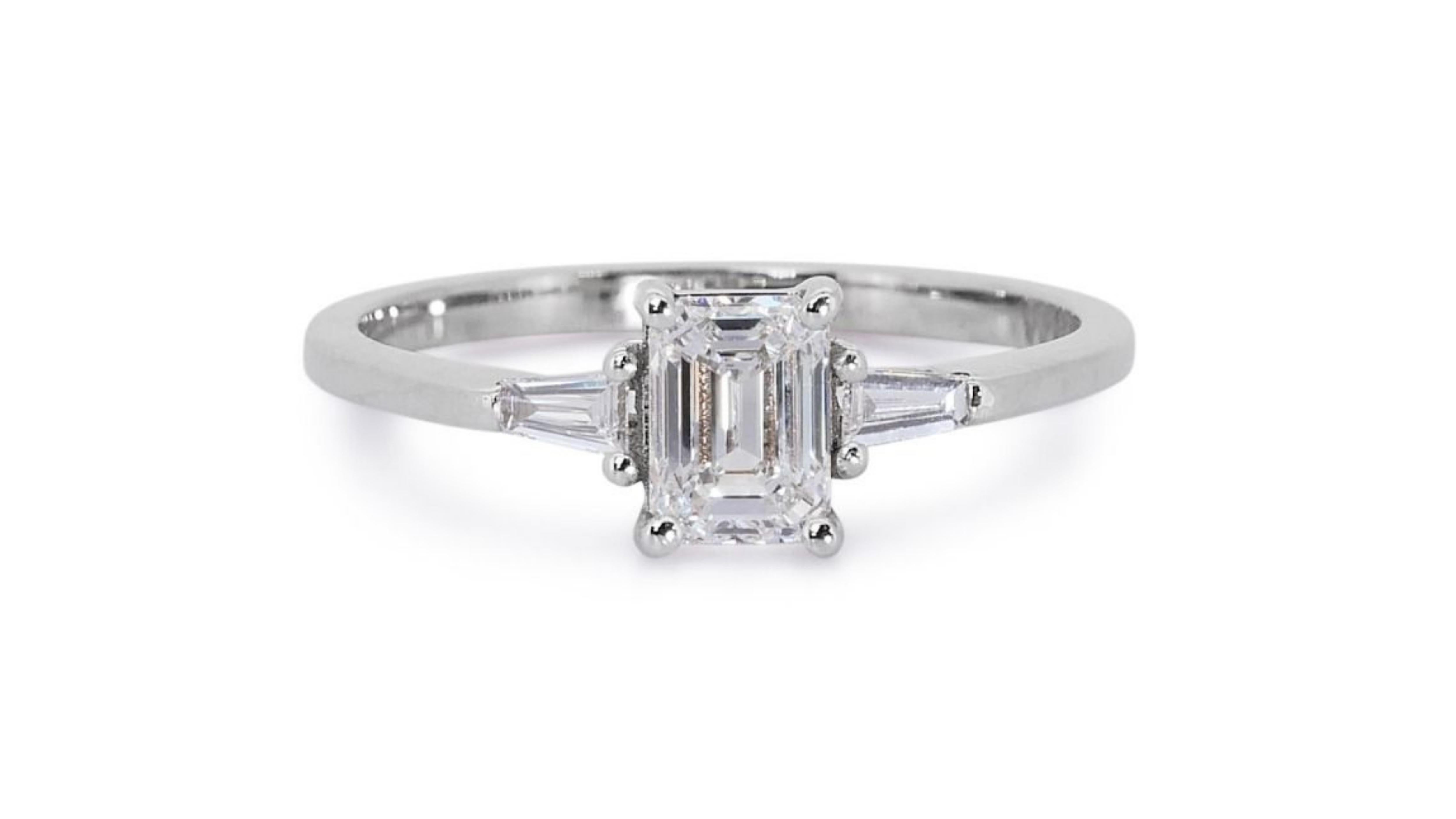 Sparkling 18k White Gold .71ct Emerald Cut Three Stone Diamond Ring For Sale 4