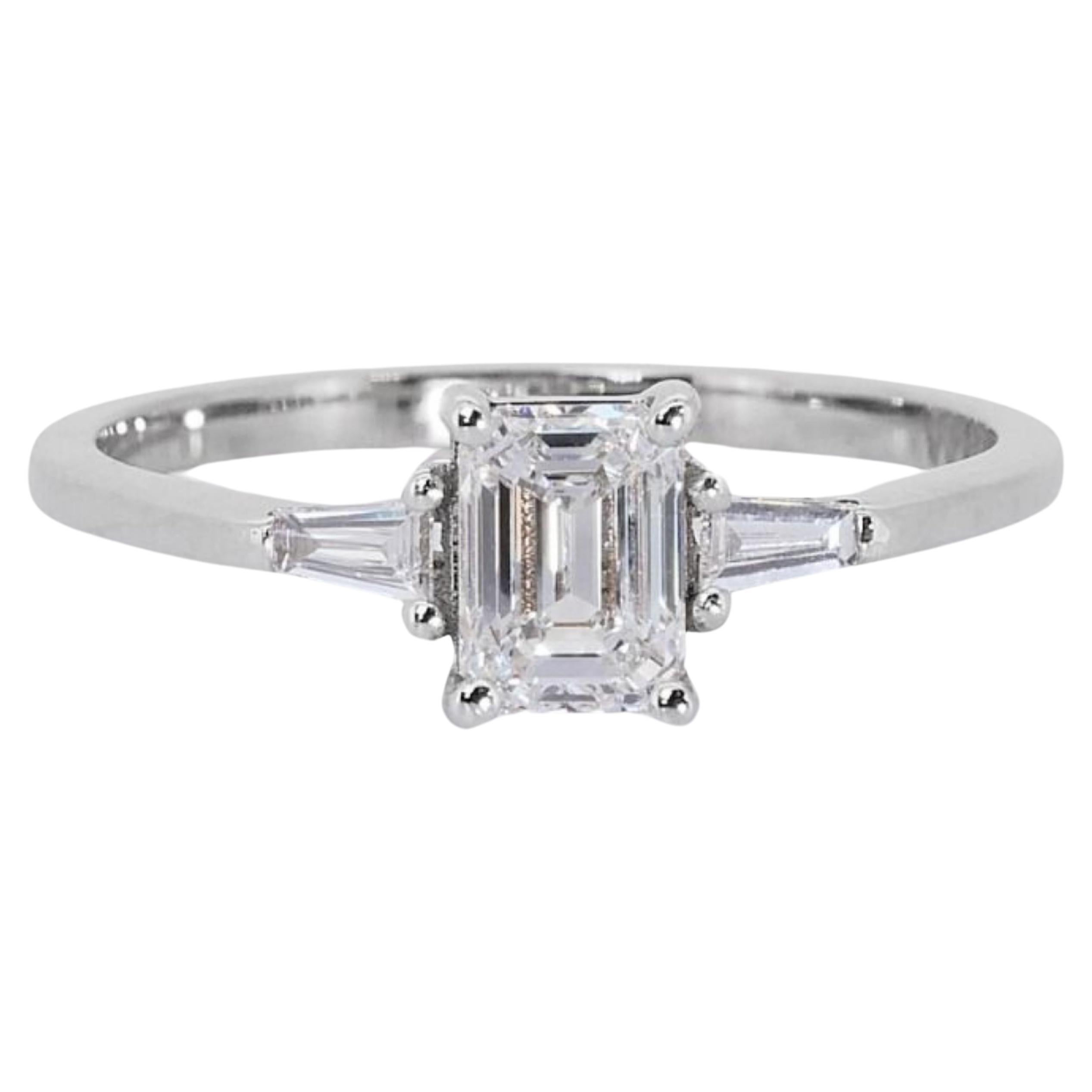 Sparkling 18k White Gold .71ct Emerald Cut Three Stone Diamond Ring For Sale