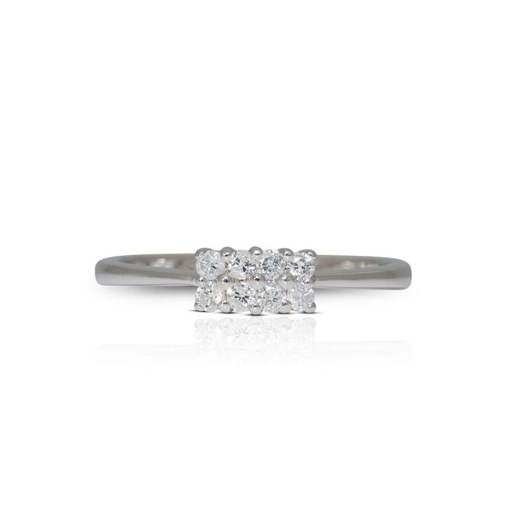 The centerpiece of this ring is a dazzling 0.16-carat diamond, selected for its exceptional clarity and brilliance. This diamond is thoughtfully set within the pristine 18K white gold setting, which not only enhances the stone's natural fire but