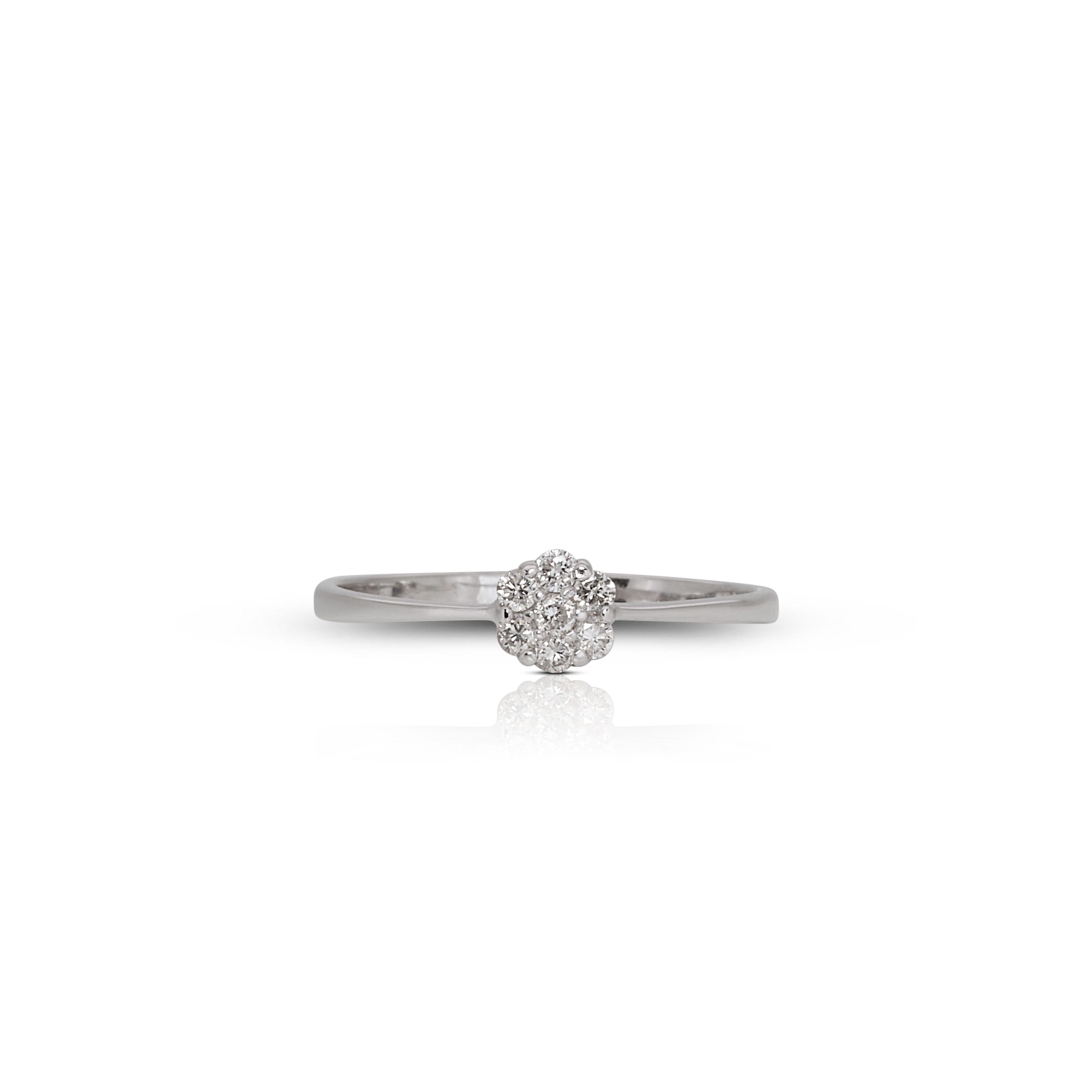 Sparkling 18k White Gold Diamond Ring with .20ct Natural Diamond

Our exquisite 18k White Gold Diamond Ring is a timeless masterpiece that seamlessly blends sophistication and elegance. Crafted with precision and attention to detail, this stunning