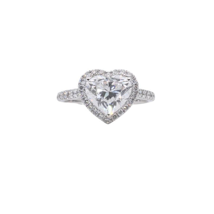 A gorgeous heart halo ring with a dazzling 2 carat heart shape natural diamond. It has 0.27 carat of side diamonds which add more to its elegance. The jewelry is made of 18k White Gold with a high quality polish. It comes with a fancy jewelry