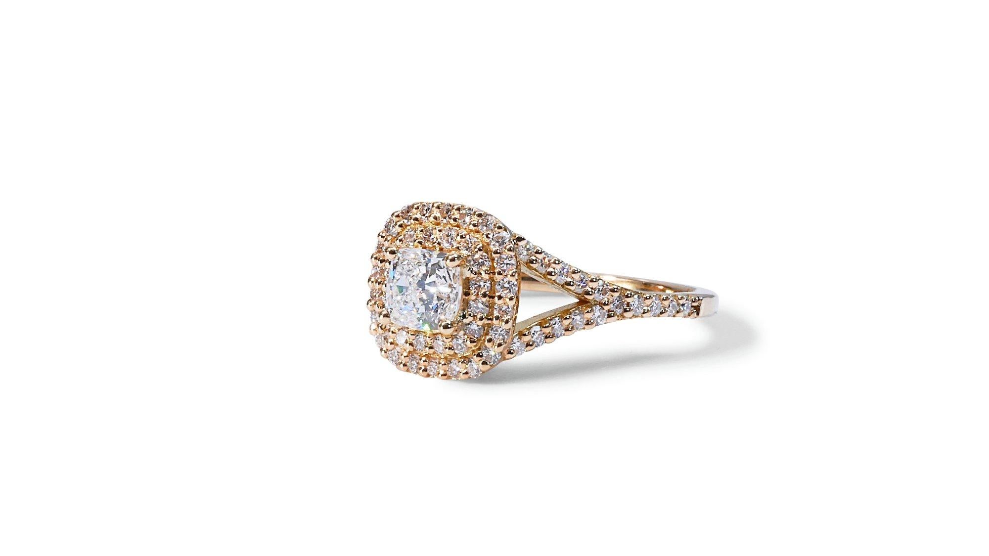 Sparkling 18k Yellow Gold Natural Diamond Double Halo Ring w/1.25 ct - GIA Certified

This sparkling double-halo diamond ring is a captivating symbol of enduring love and timeless style. A mesmerizing 0.90-carat cushion-cut diamond as its