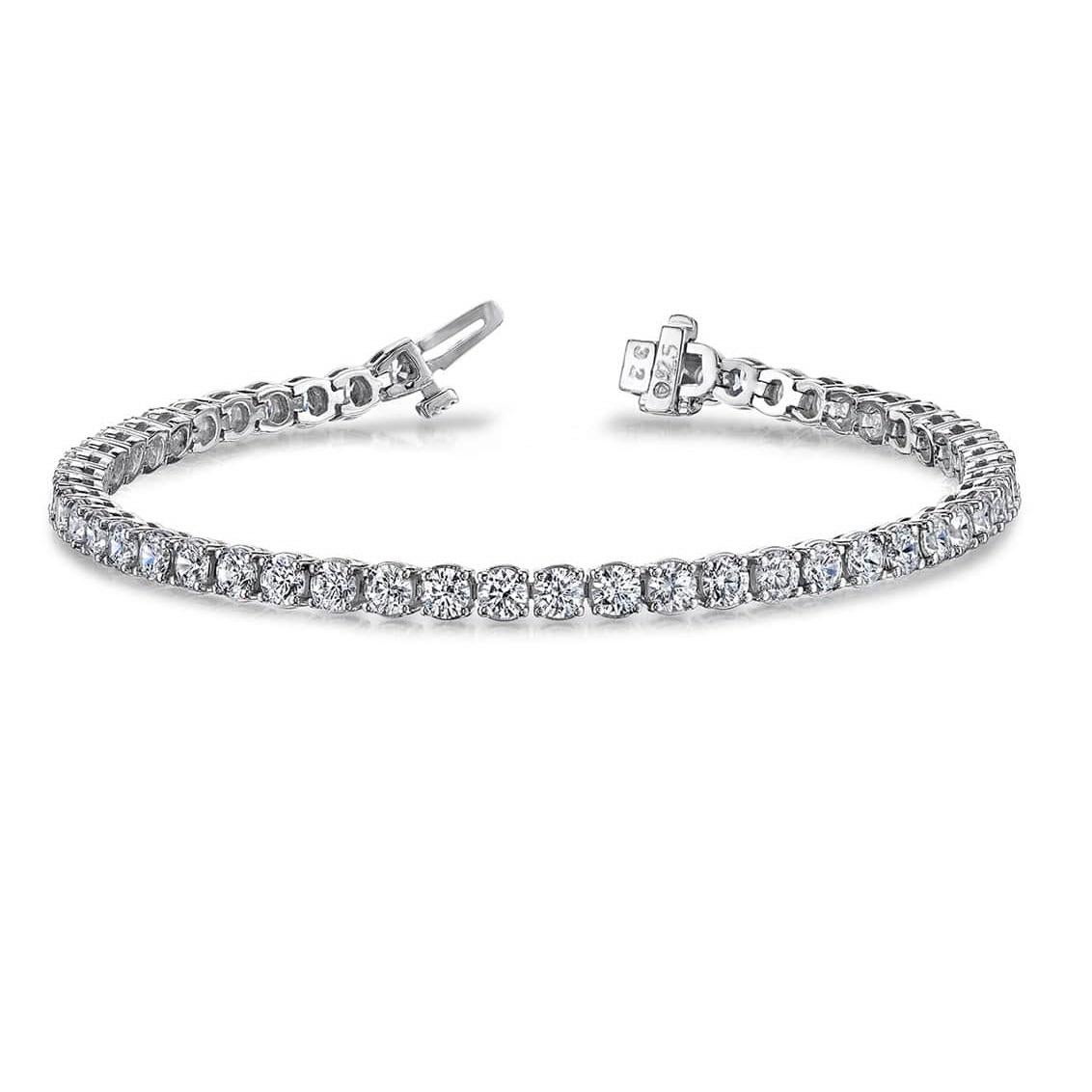 This bracelet exudes a timeless and radiant charm. It showcases round white diamonds, securely held in a four-prong setting, with a total weight of 8.90 carats. The piece is meticulously crafted in 14k White Gold, and the 44 diamonds possess H-I