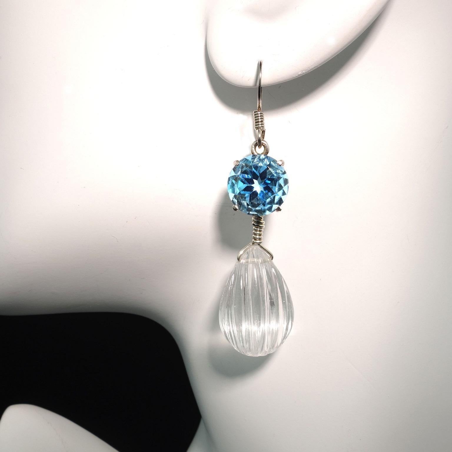 These unique earrings are perfect for when you're teleconferencing! And, they are available for immediate shipment.
Custom made, one of a kind earrings that sparkle and dance and you move. 
Carved clear Quartz Crystal suspended from bright, lively,