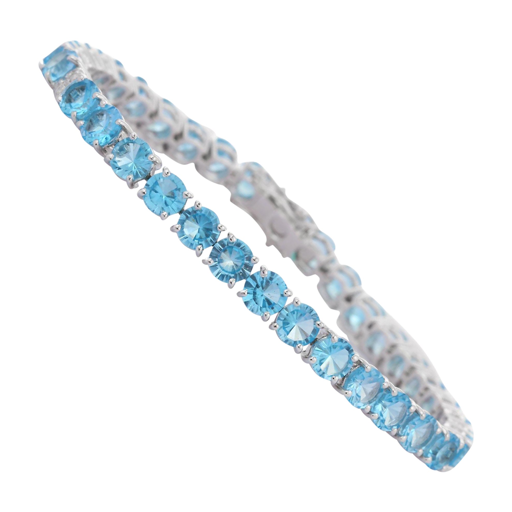 Brillante pulsera de tenis de topacio azul en oro blanco macizo de 18 quilates con diamantes
