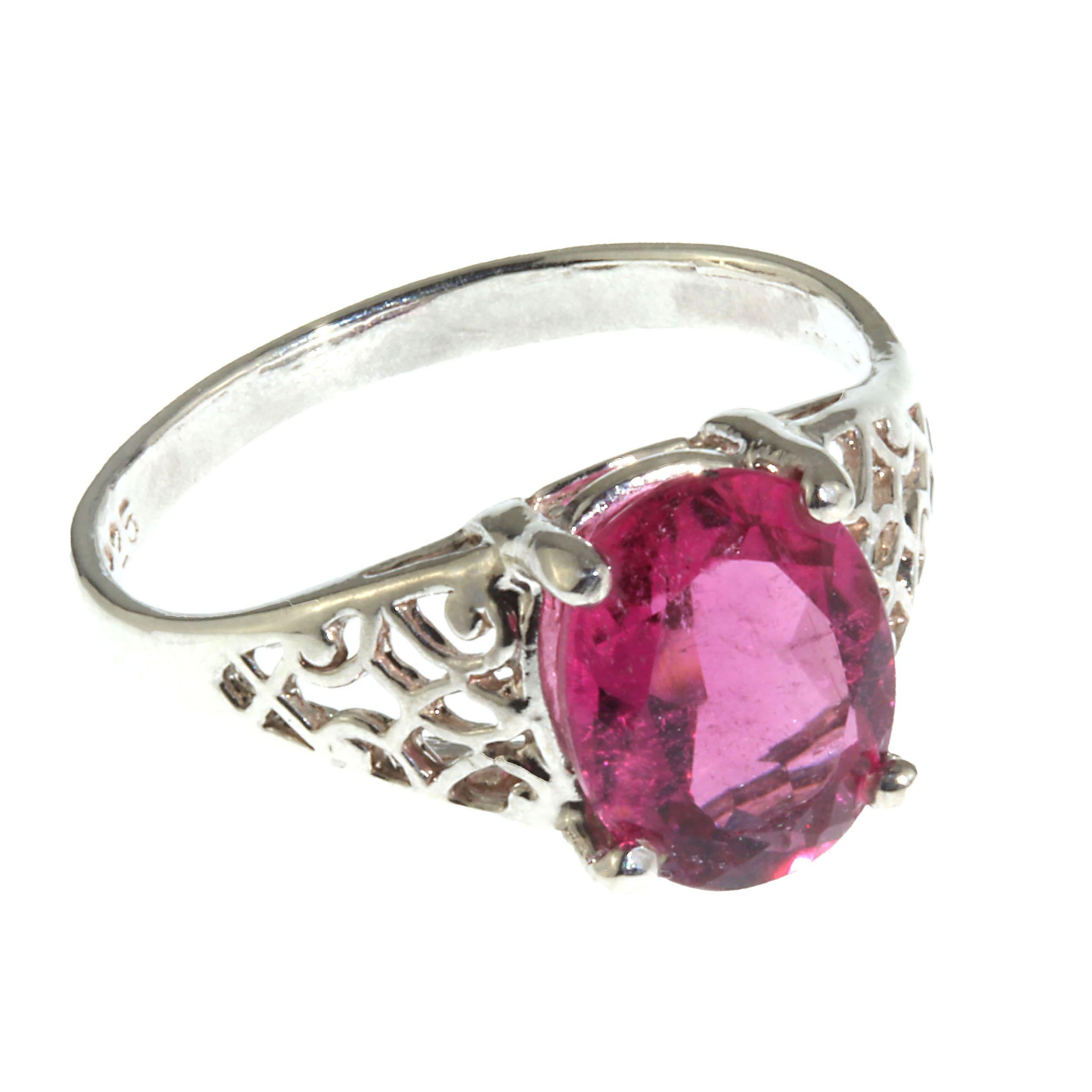 Custom made sterling Silver Ring featuring a sparkling oval Rubelite. This is a lovely bright pink Rubelite with some of the delightful natural inclusions that are usual in these types of tourmalines. Delicate open work detail in the setting