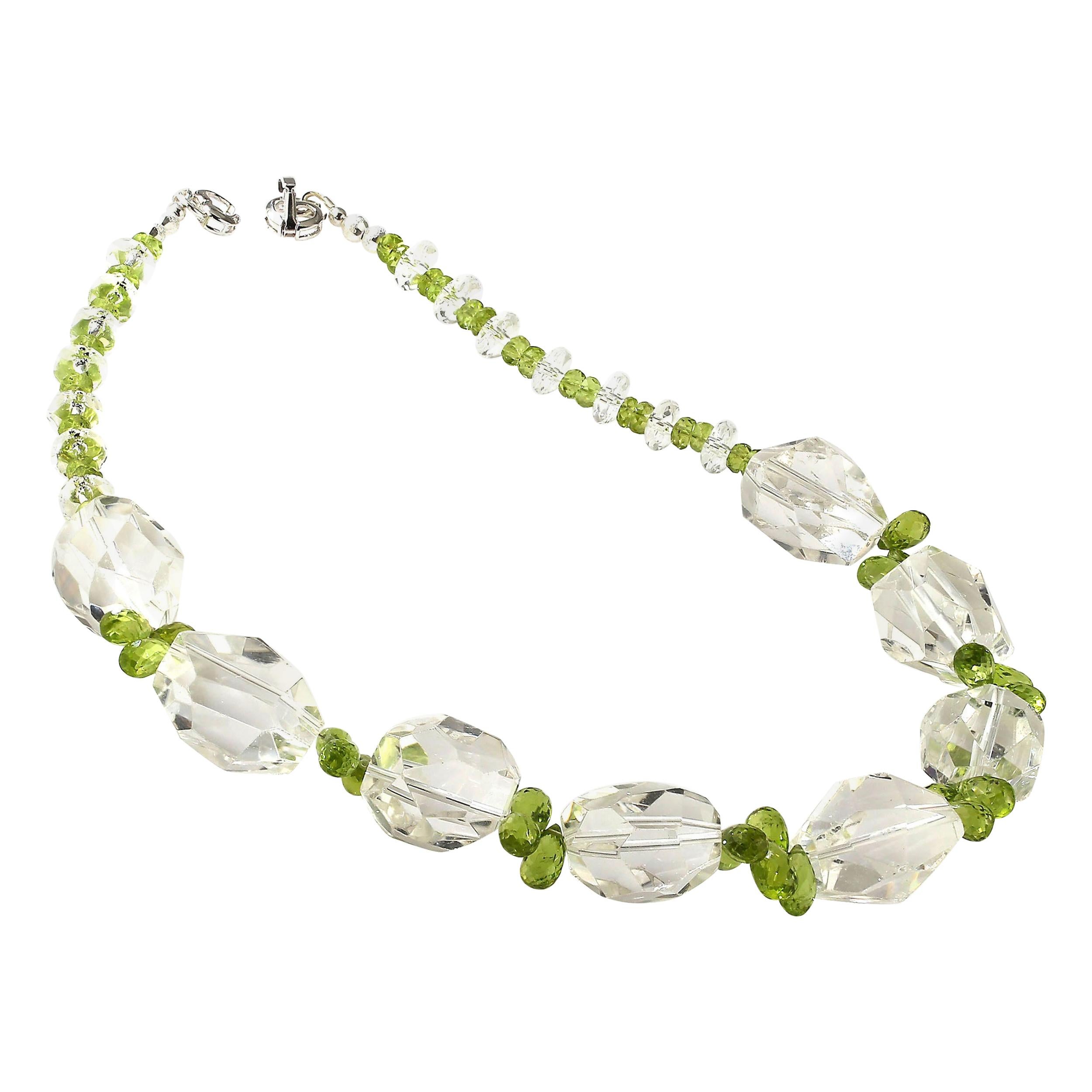 16 Inch Glittering choker necklace of faceted Quartz Crystal nuggets and green Peridot briolettes. This unique necklace sparkles and flashes as you move. The eight large faceted nuggets across the front of the necklace are accented with clustered