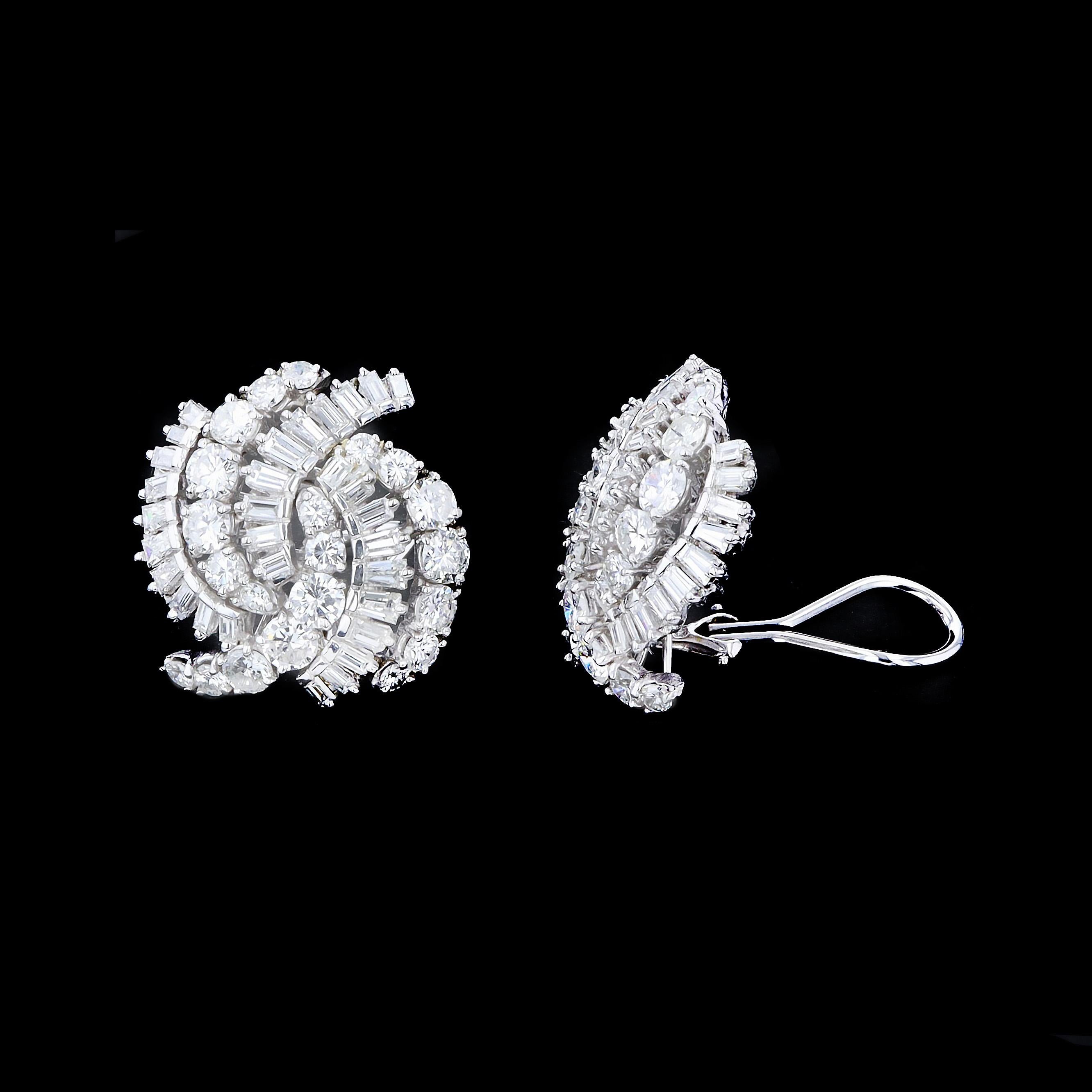 Exceptional curved lines of glittering diamonds merge to create a stunning statement in these on the ear estate earrings. The earrings contain G color VS1 clarity diamonds weighing 6.00 TWT ctw.

