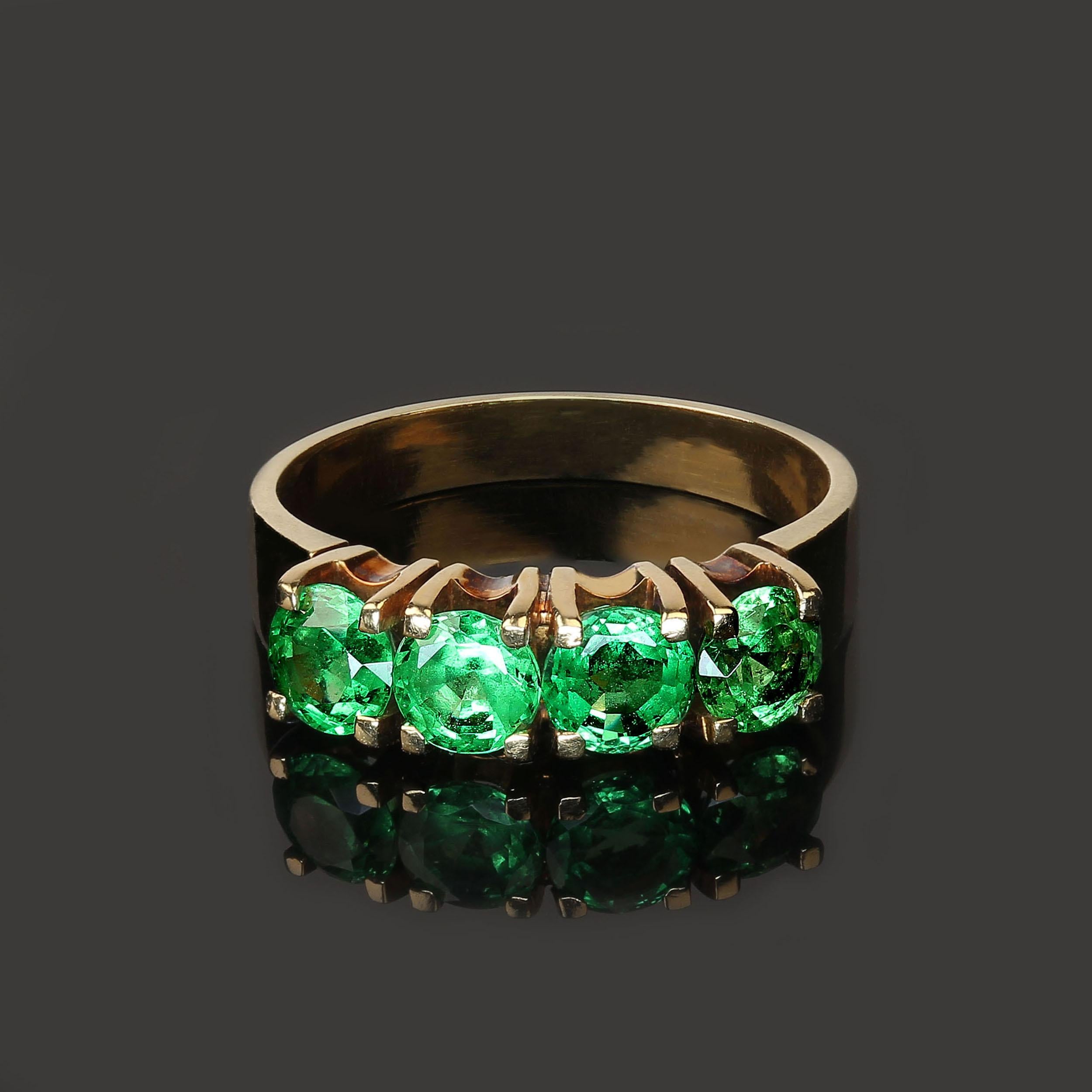 Enjoy brilliant green Tsavorite Garnets every day with this gorgeous band of gemstones.  These lovely gemstones are a brilliant green.  The four gemstones are 4.3-4.5 MM in size and with an estimated weight of 1.40 ctw.  This ring  features garnets