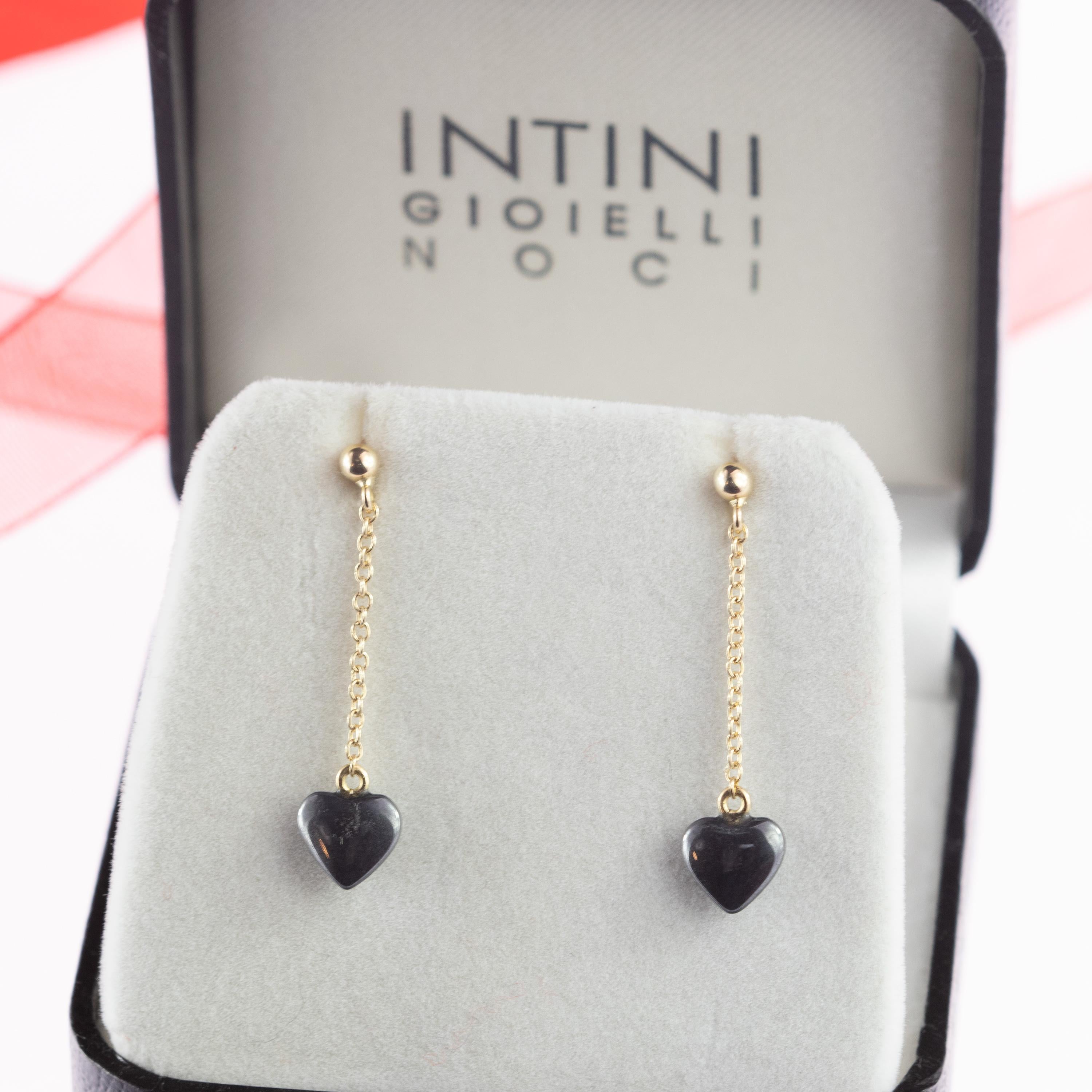 Stunning sparkling drop and delicate grey hematite heart  Valentine's Day Earrings. 5.5 hematite carat stone embellished with 18 karat yellow gold chain. Perfect gift for your Valentine. 

Inspired by a rich heart, full of love, faith and good
