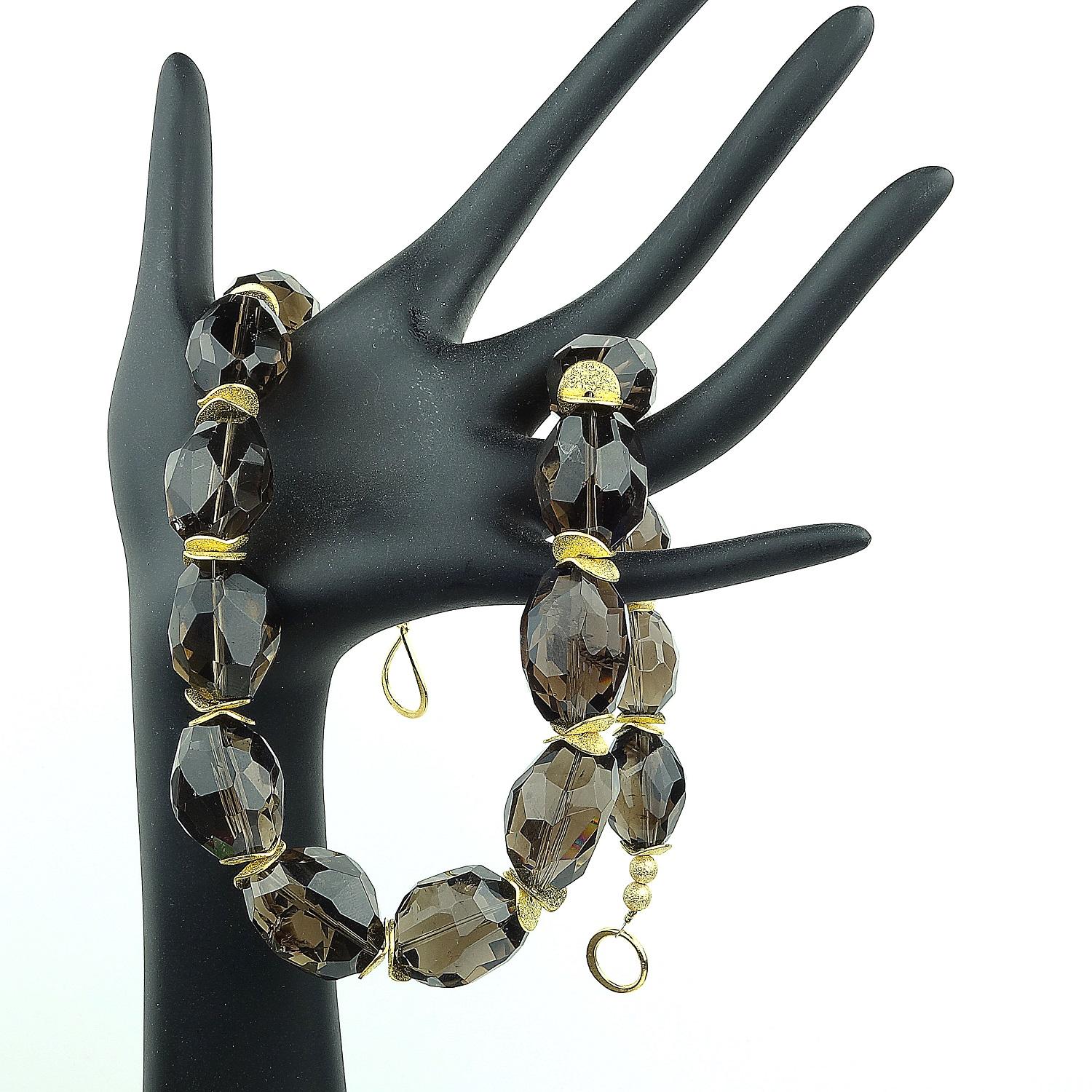 Custom made necklace of large nuggets of softly faceted transparent Smoky Quartz wth accents of gold tone wavy flutters and a gold vermeil (gold over sterling silver) hook clasp.  These gorgeous Smoky Quartz are sparkly and flashy. This is such a