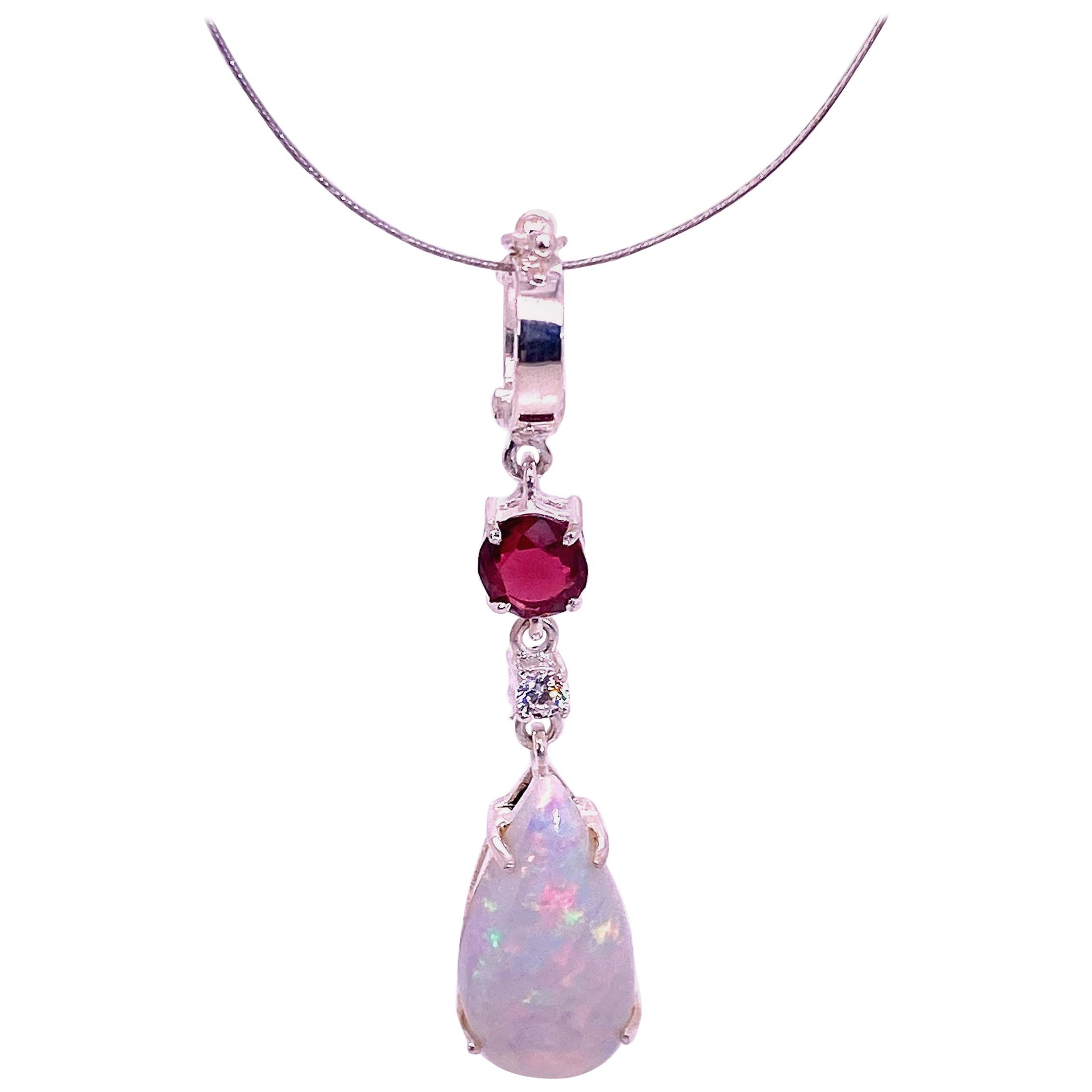 AJD Sparkling Opal Pendant with Accents of Garnet and Zircon For Sale