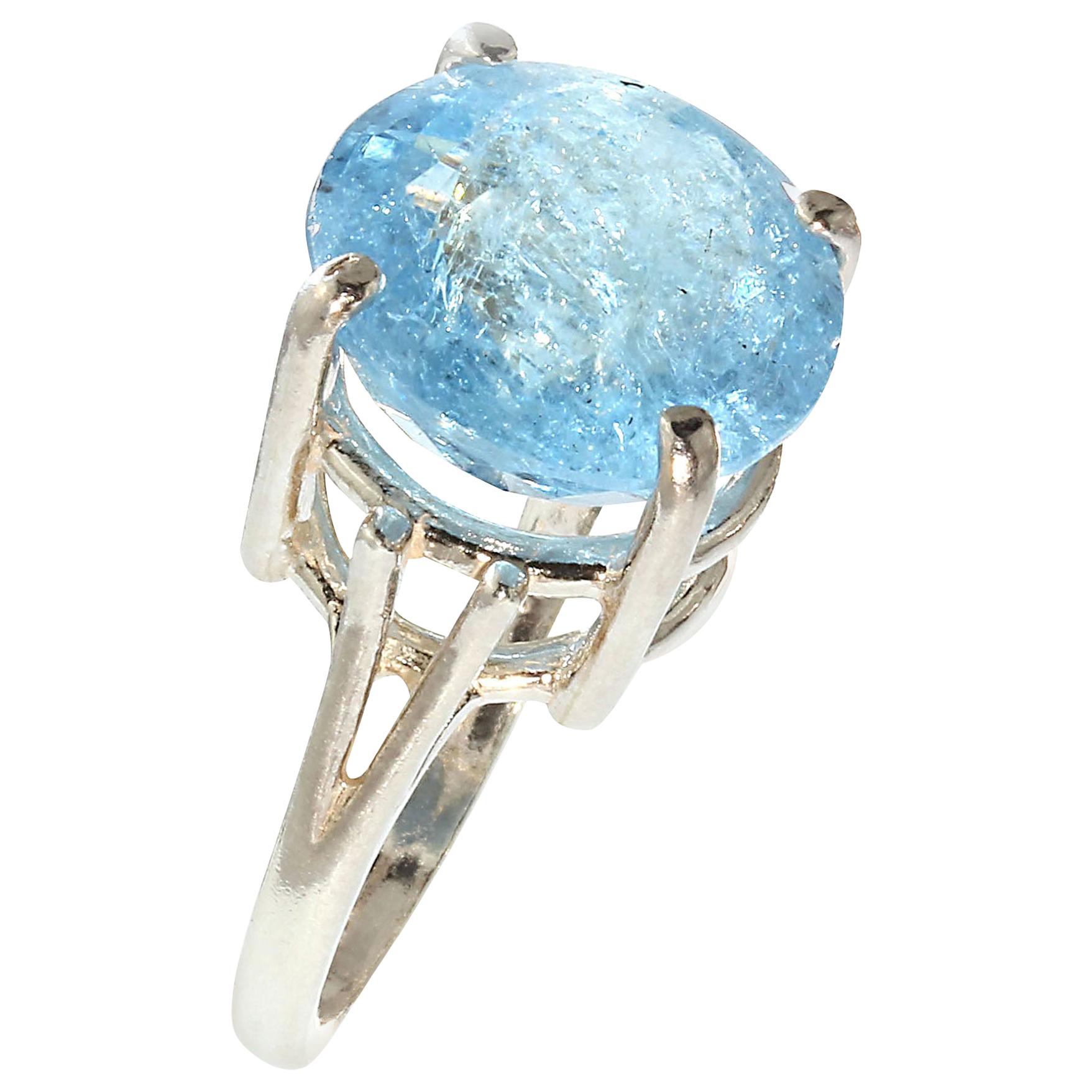 Custom made, Sterling Silver and Glittering, Round Aquamarine Ring. Round stones are so lovely and calming. This gorgeous gem is 13 MM. The  unique gemstone has a checkerboard table and interesting inclusions which enhance its color and sparkle.