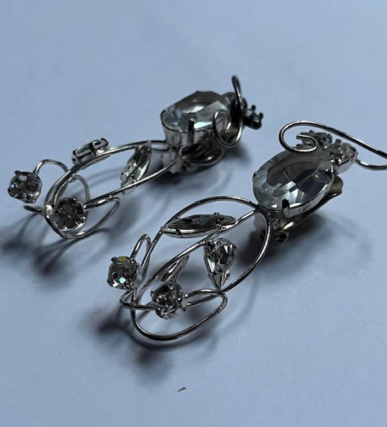 Oval Cut Sparkling Silver Clip-on Earrings with Crystal Accents by Daniel Swarovski For Sale