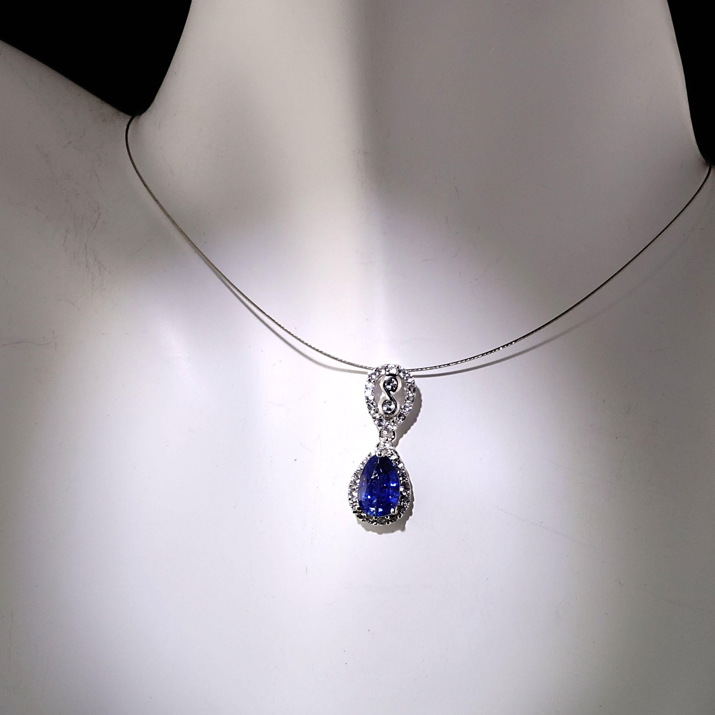 Unique pendant with pear shape faceted blue Kyanite (2ct) which is seated in the lower part of two Sterling Silver pear shapes.  Each piece features sparkling white topaz (.38ct).  This one of a kind pendant is 15/16 inches in length.  Wear this