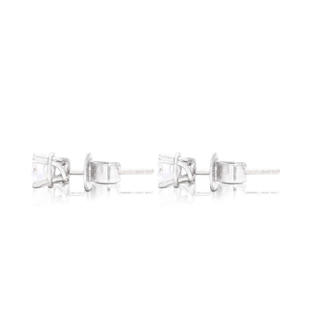 Women's Sparkling Solitaire Stud Diamond Earrings set in 18K White Gold For Sale