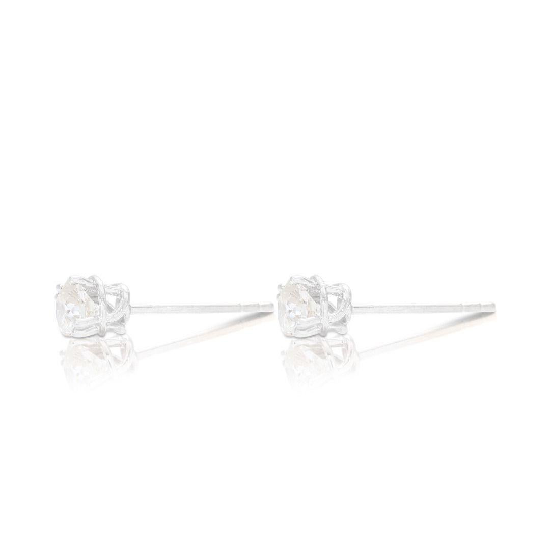 Sparkling Solitaire Stud Diamond Earrings set in 18K White Gold For Sale 1