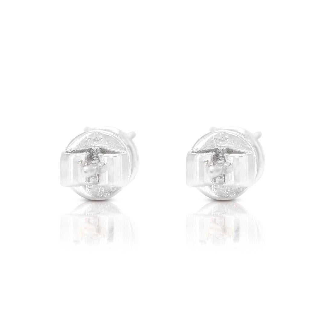 Sparkling Solitaire Stud Diamond Earrings set in 18K White Gold For Sale 2