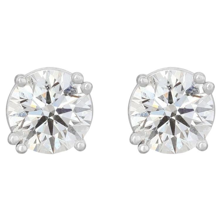 Sparkling Solitaire Stud Diamond Earrings set in 18K White Gold For Sale