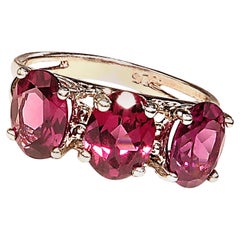 AJD Sparkling Three-Stone Oval Rhodolite Garnet Ring of Sterling Silver