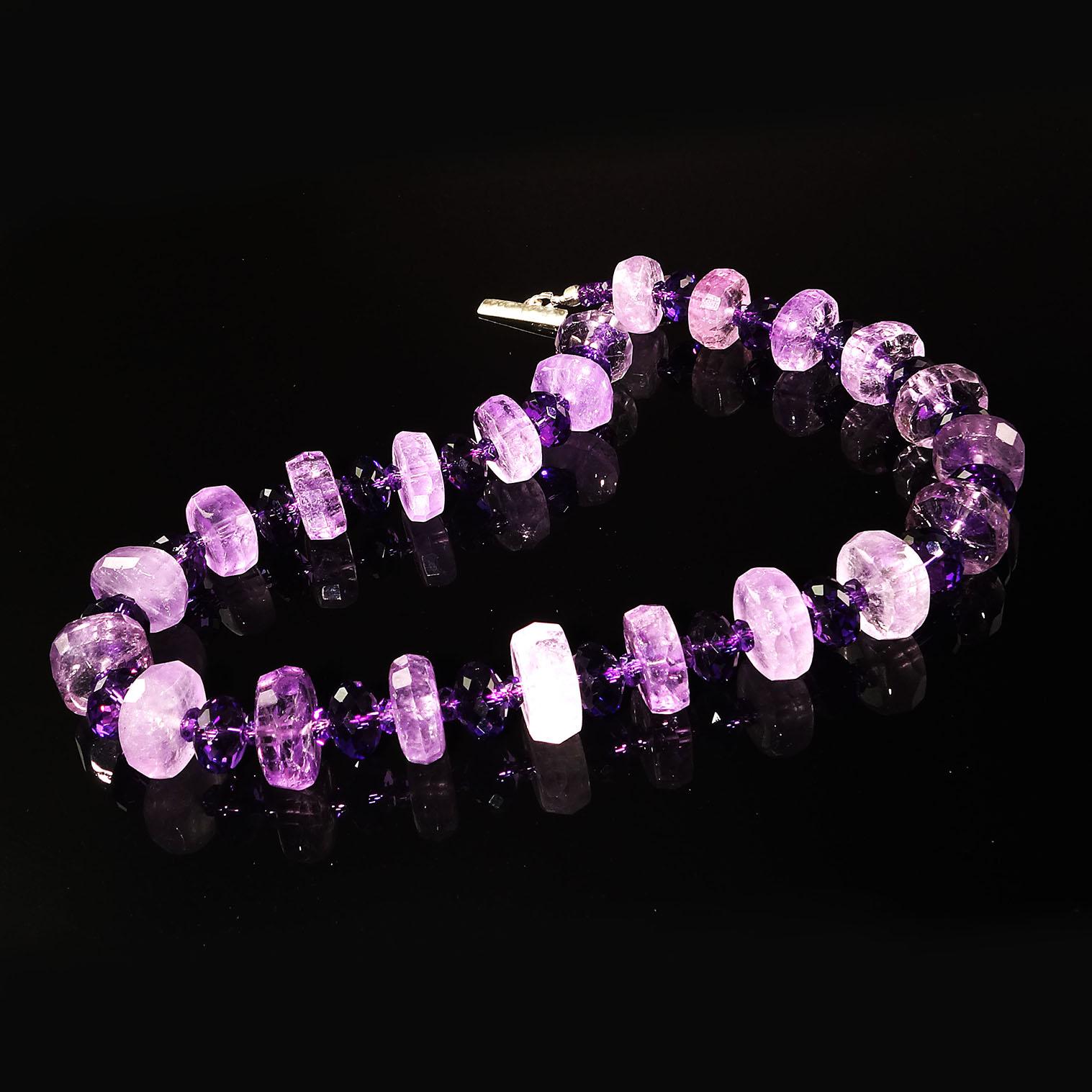 Handmade, unique necklace of rondels of larger, lighter Amethyst and alternating with fully faceted darker Amethyst in two sizes.  The larger Amethyst are 14MM with flat sides and faceted edges.  The 10MM darker sparkling Amethysts are fully faceted