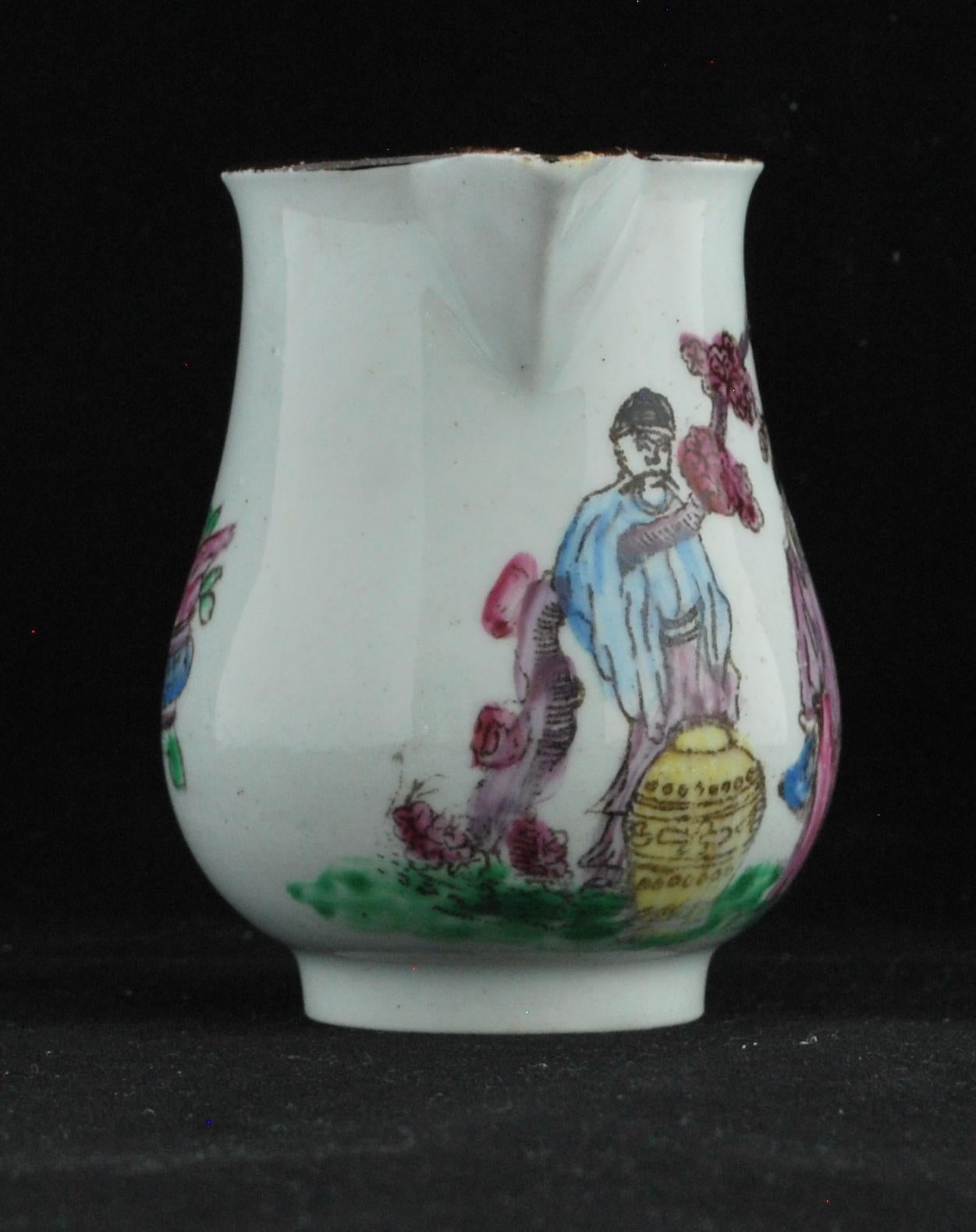 A small pear-shaped milk jug, with a transfer-printed outline, filled with wet enamels, in the Chinese Mating Chickens pattern; the rear with symbols of pomegranate, leaves and censer.

Prov: Taylor Collection; John Wilson Antiques