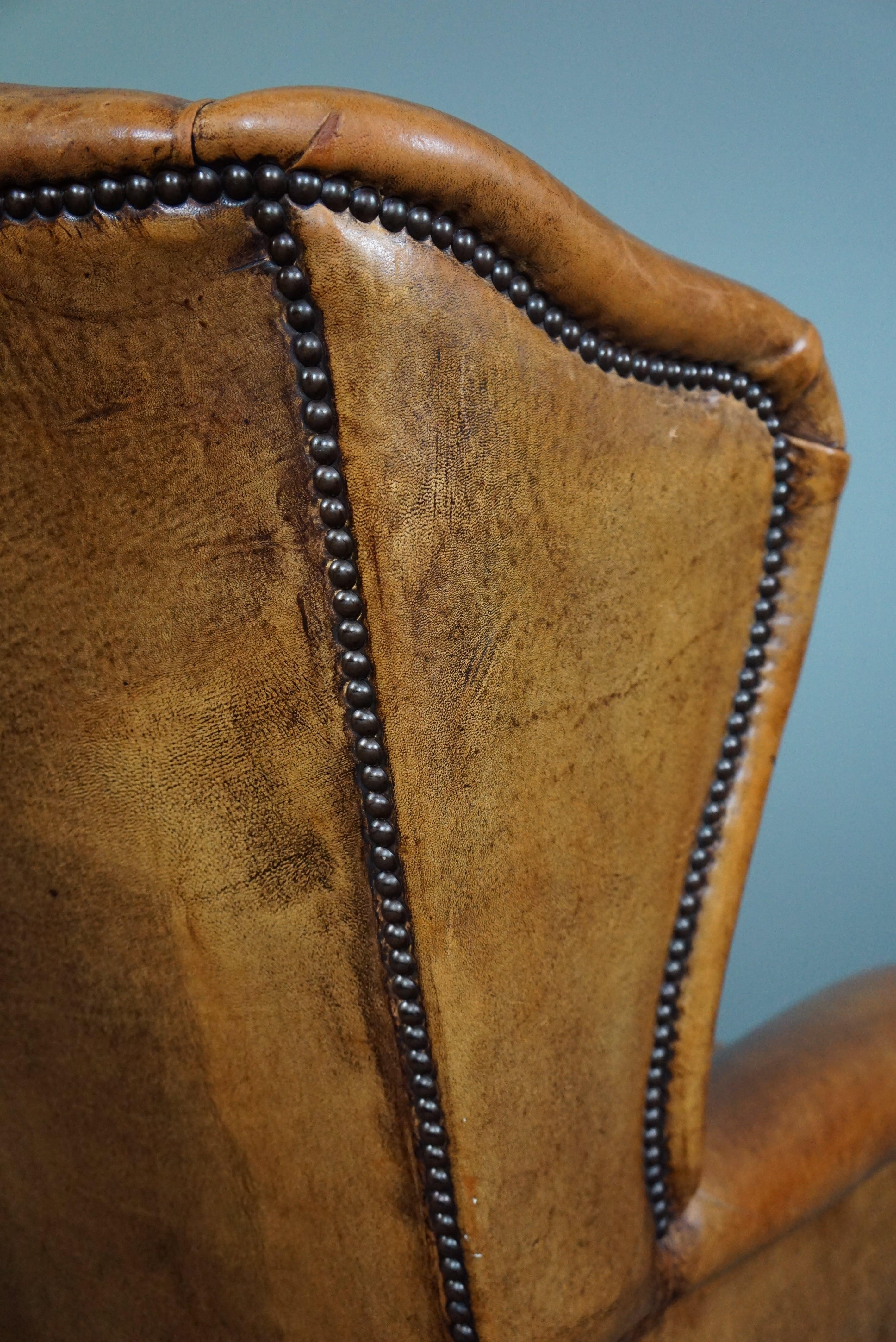 Speaking cognac colored sheep leather wing armchair For Sale 3