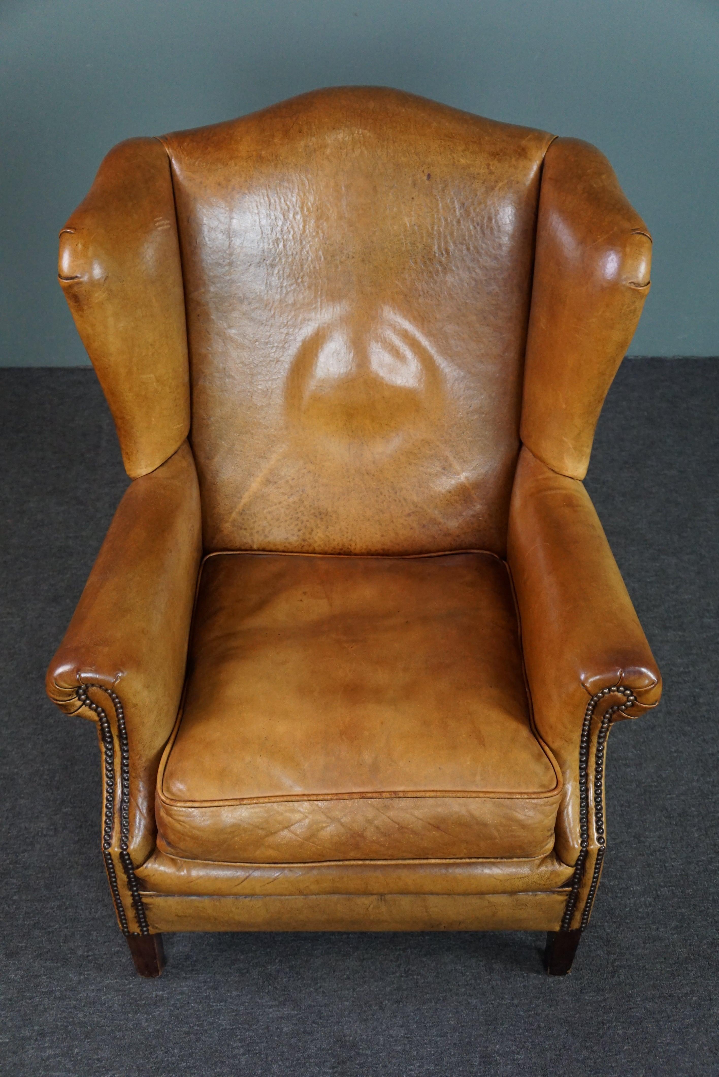 Contemporary Speaking cognac colored sheep leather wing armchair For Sale