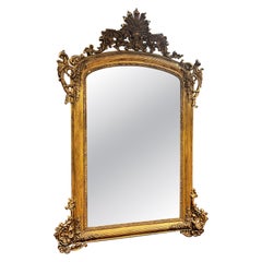Specchiera dorata con cimasa traforata e scolpita, Italia