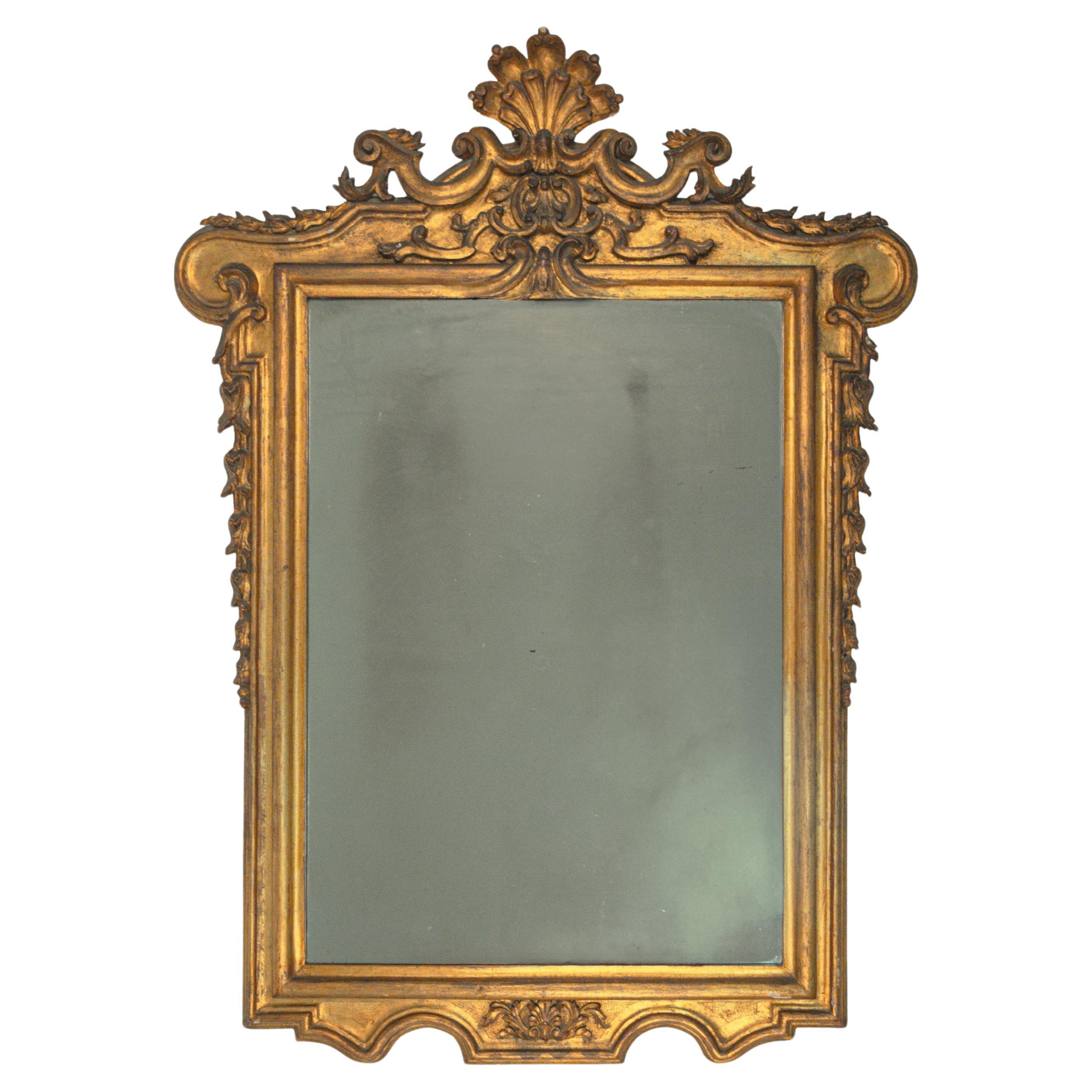 Carved and gilded wooden mirror, 19th century