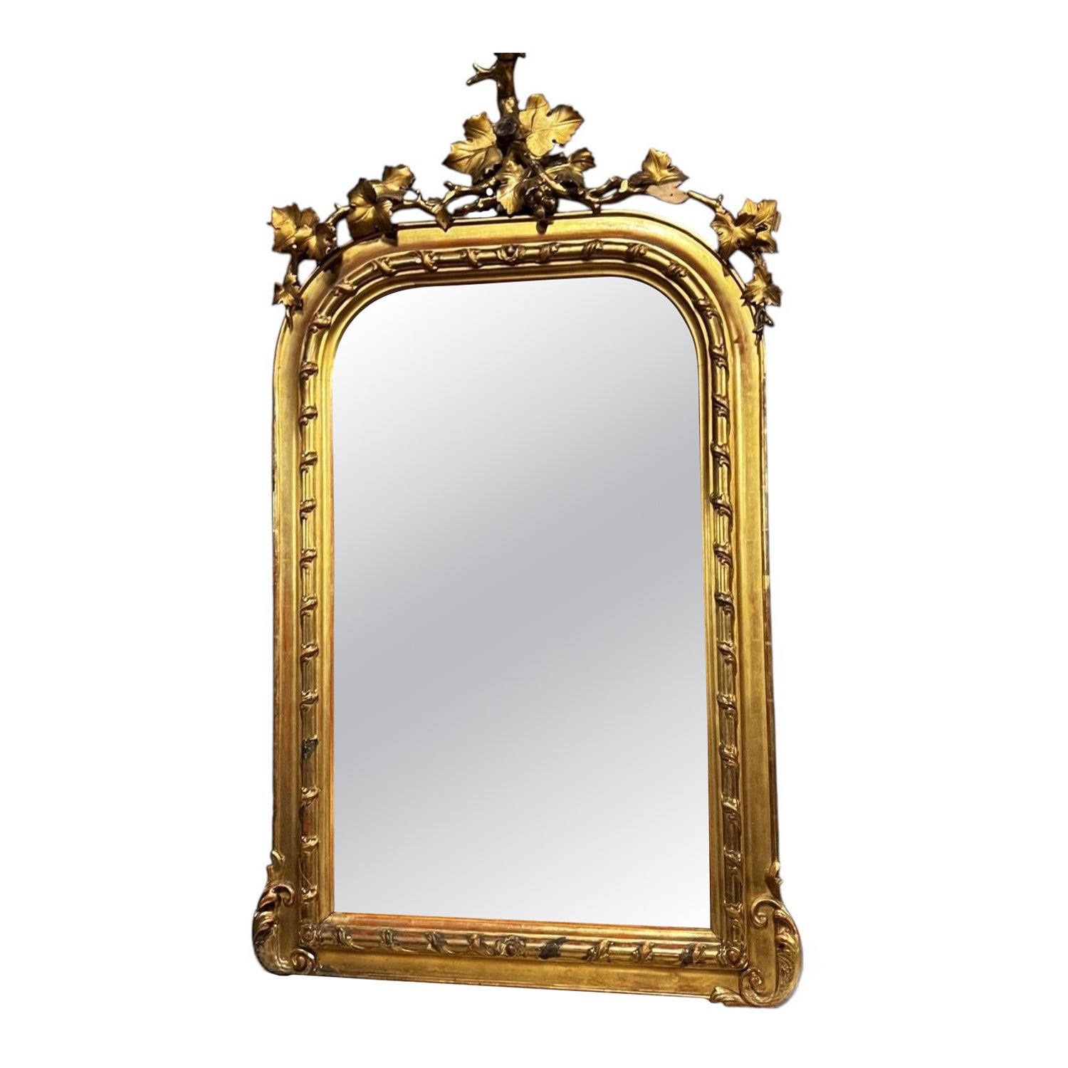 A carved and gilded mirror in the Second Empire style from the late 19th century. For Sale