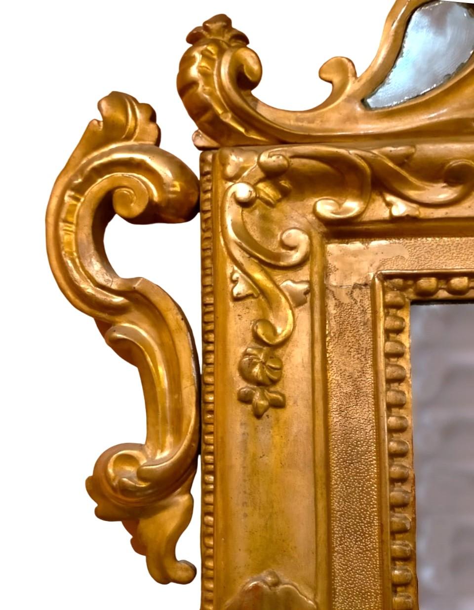 Louis XV gilded mirror Venice

Large Louis XV mirror, Venetian.
Gold leaf gilded and carved mirror, with original mercury mirror.
Cimasa carved with scrolls, floral motifs and small decorative mirrors.
Epoch: second half of the 1700s
Measurements: