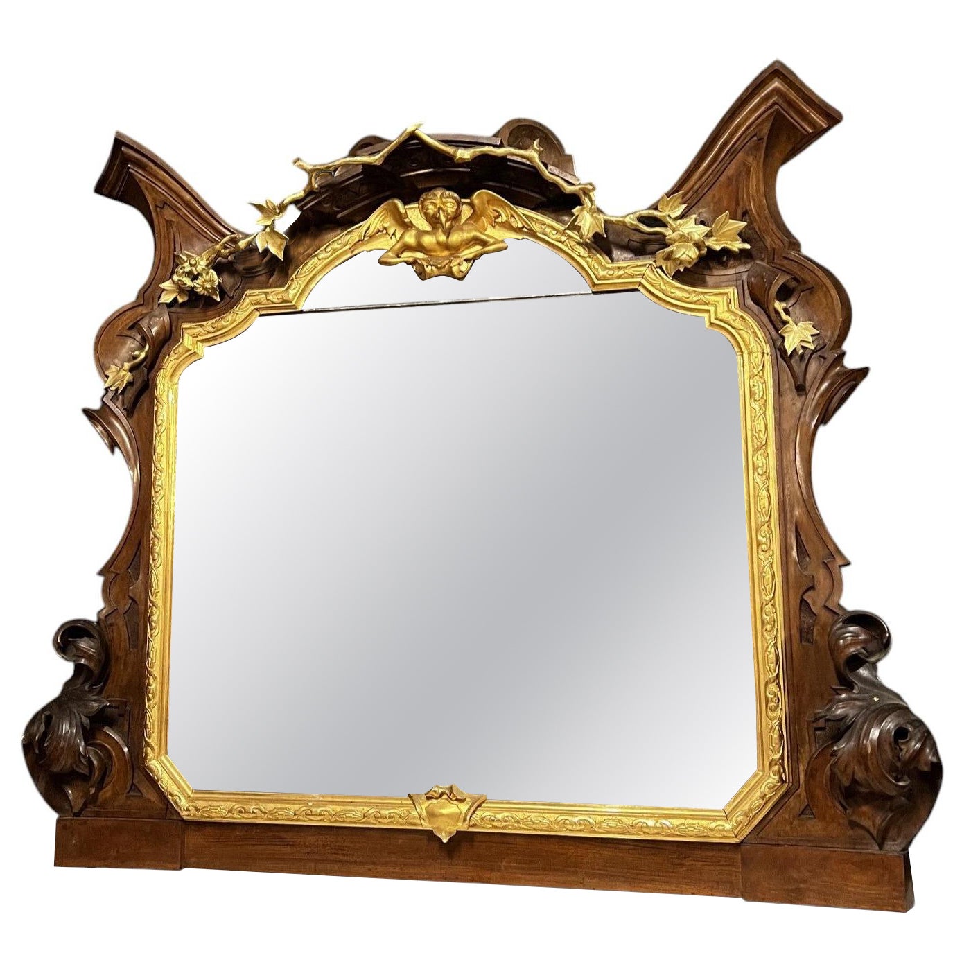 Monumental mirror made of carved walnut and gilded wood, late 19th century For Sale
