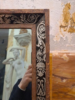 Small mirror with black glass and silver decoration