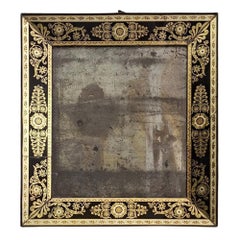 Espejo de mesa con cristal negro decorado con motivos dorados