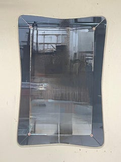 Miroir mural à double épaisseur des années 1950 avec profilé et montants en laiton