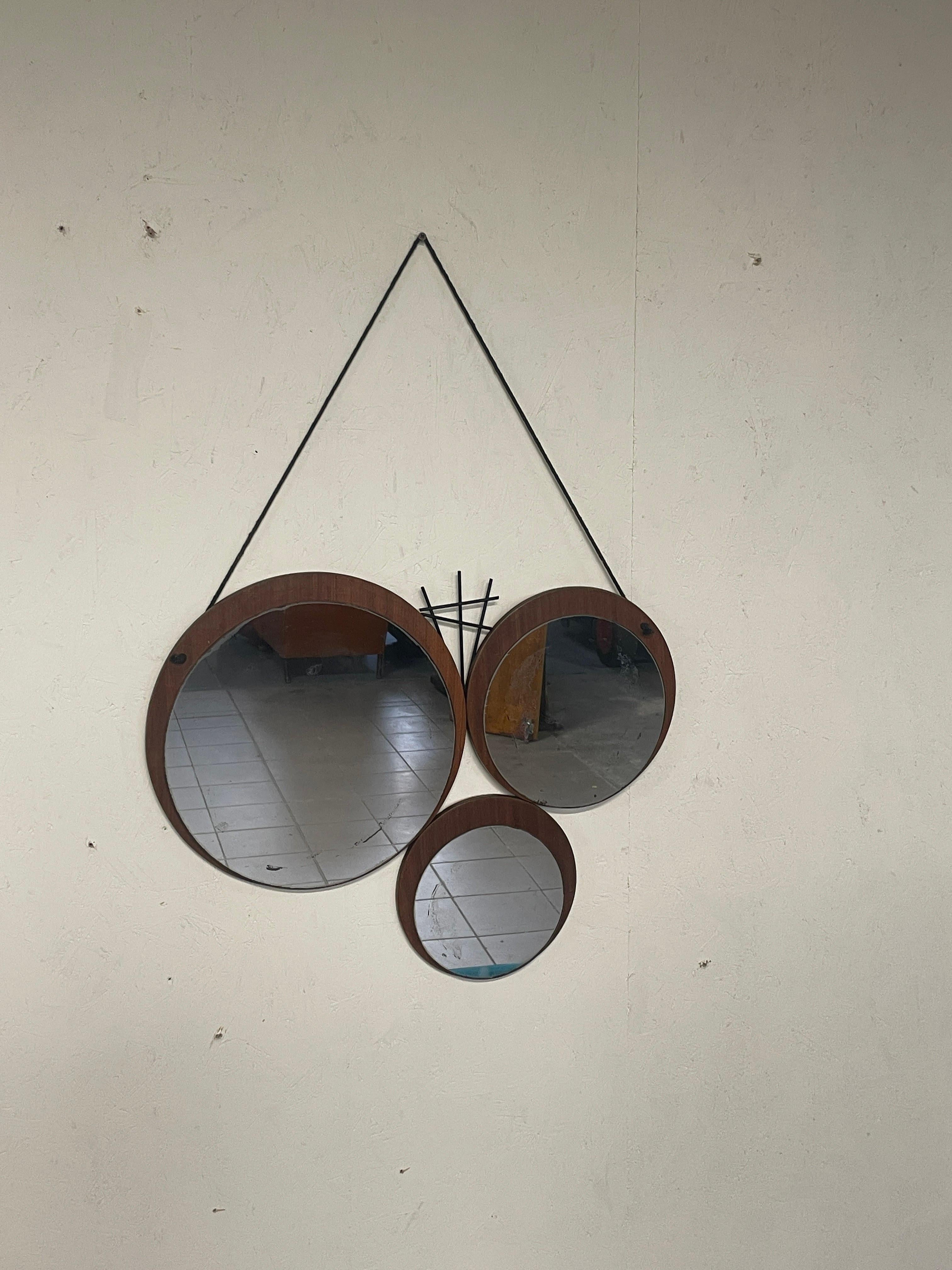 Italian 1960s mirror with geometrically patterned teak base For Sale