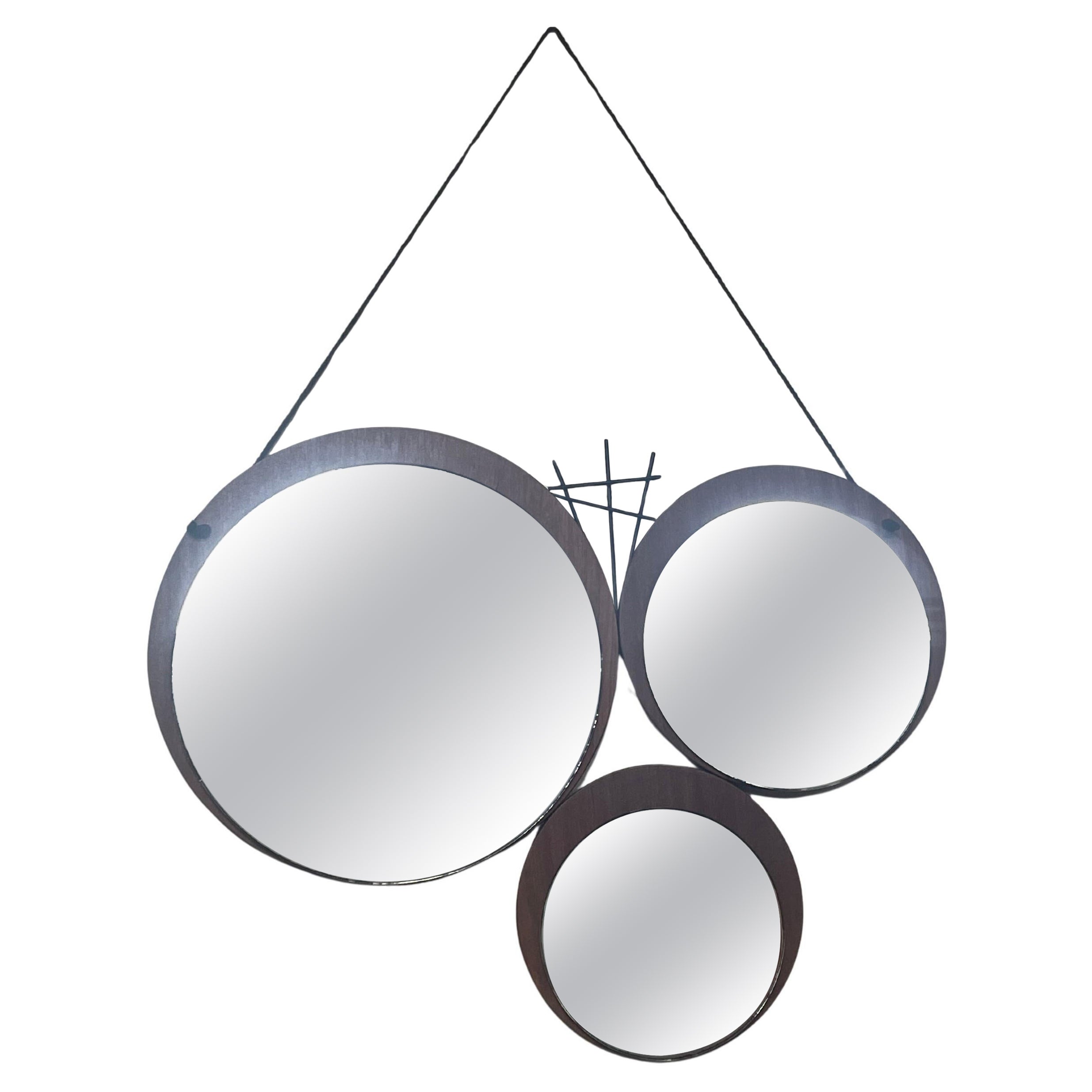 1960s mirror with geometrically patterned teak base For Sale